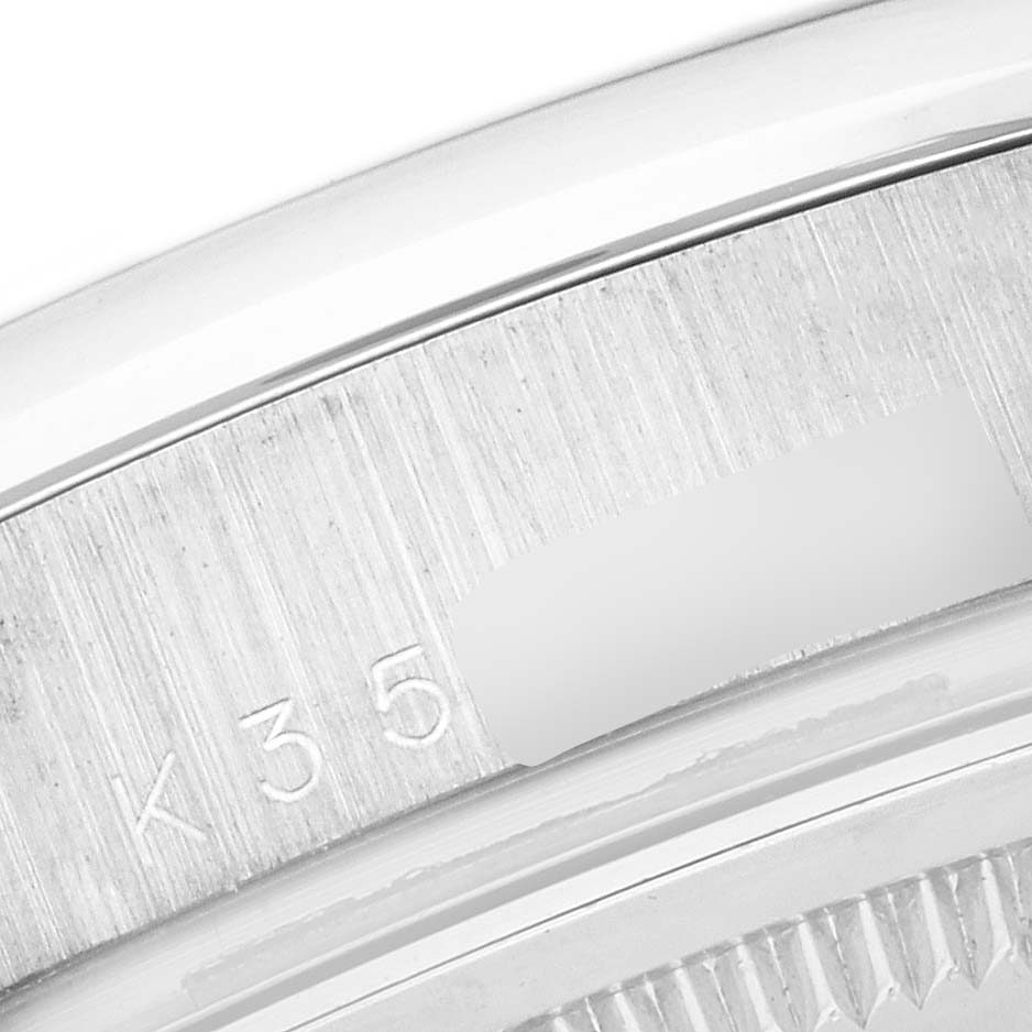 This image shows a close-up of the case back and serial number engraving of the Rolex President 118209 Men's White Gold White Dial 118209 Men's White Gold White Dial model watch.