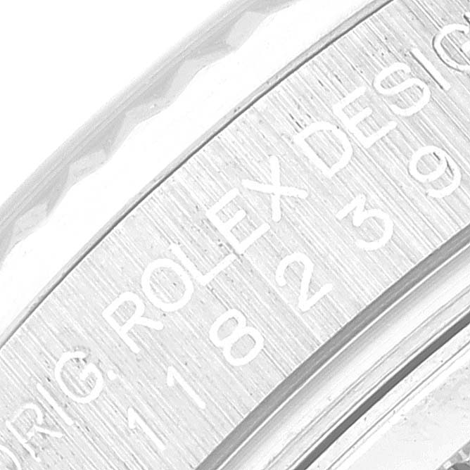 This is a close-up view of the case edge with engravings of the Rolex President 118239 Men's White Gold White Dial 118239 Men's White Gold White Dial model watch.