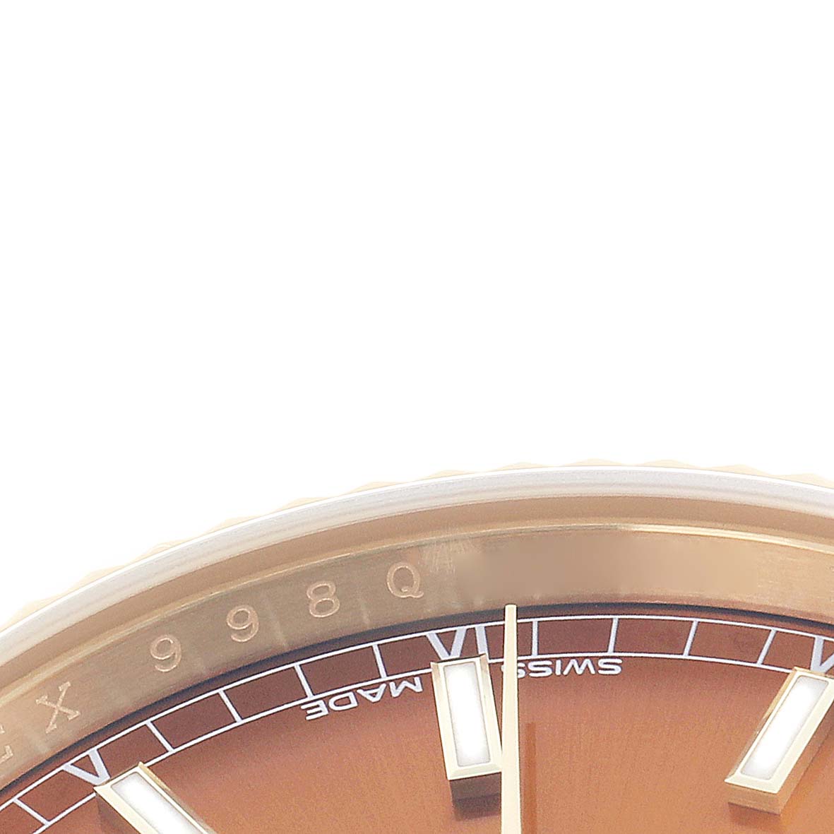 The image shows a close-up of the dial and bezel of a Rolex President 118139 Men
s Yellow Gold Orange Dial watch, featuring indices and part of the face.