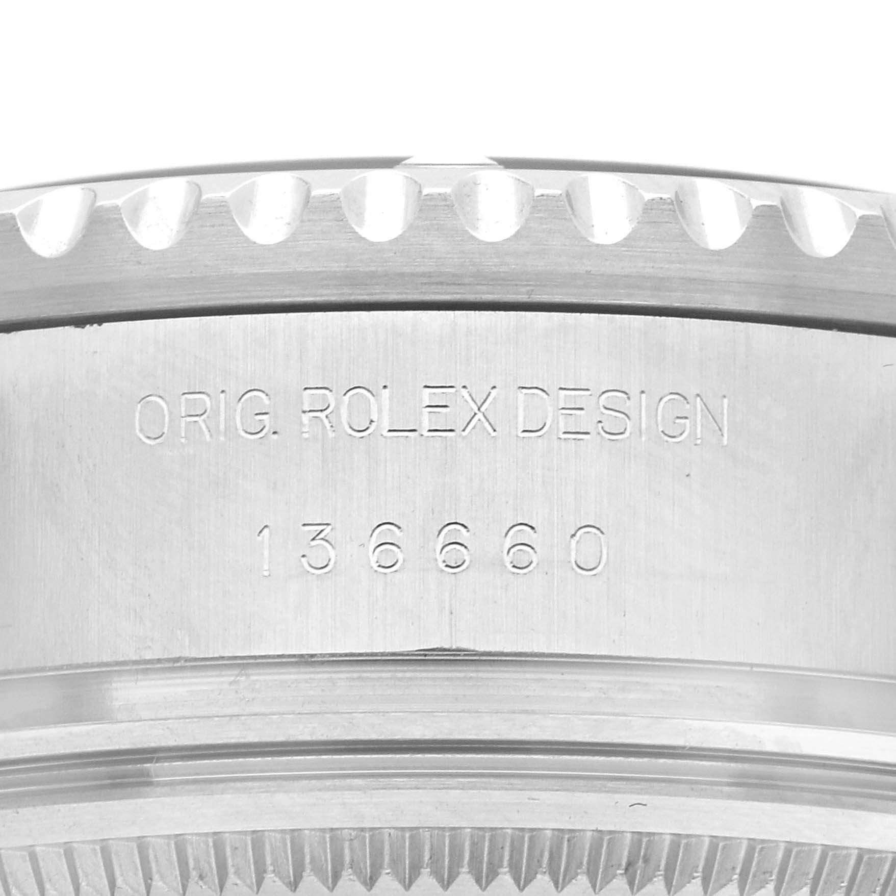 The image shows a close-up of the engraved side of a Rolex Sea-Dweller 136660 Men
s Stainless Steel Blue Dial, focusing on the "Orig. Rolex Design" and model number.