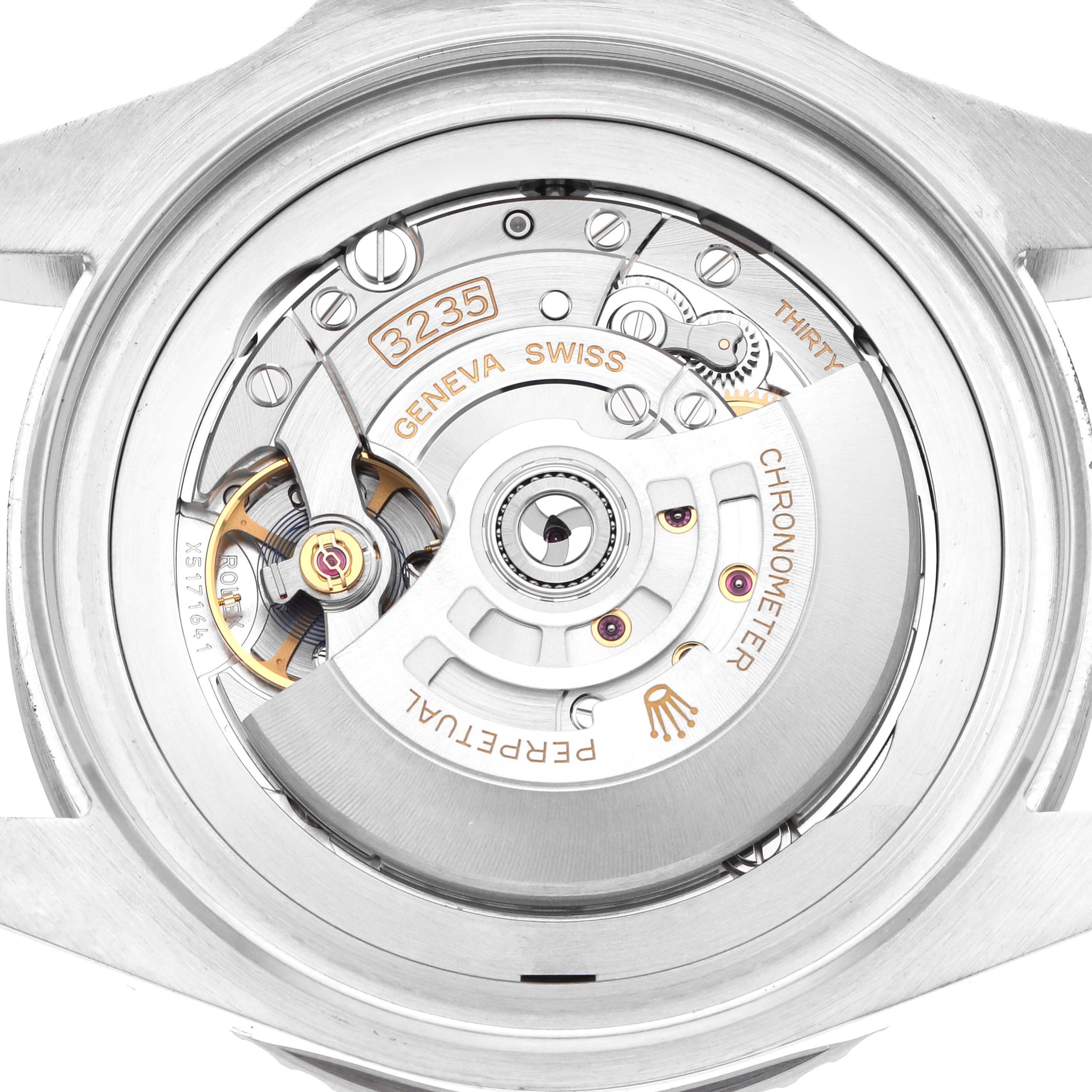 The image shows the movement of a Rolex Sea-Dweller 136660 Men
s Stainless Steel Blue Dial, highlighting the intricate mechanics and rotor from a top view.