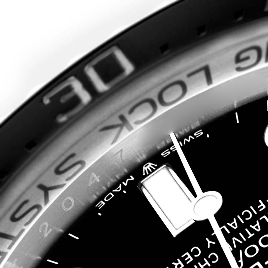 The image shows a close-up angle of the Rolex Sea-Dweller 136660 Men
s Stainless Steel Blue Dial, focusing on the bezel, part of the dial, and the "SWISS MADE" text.