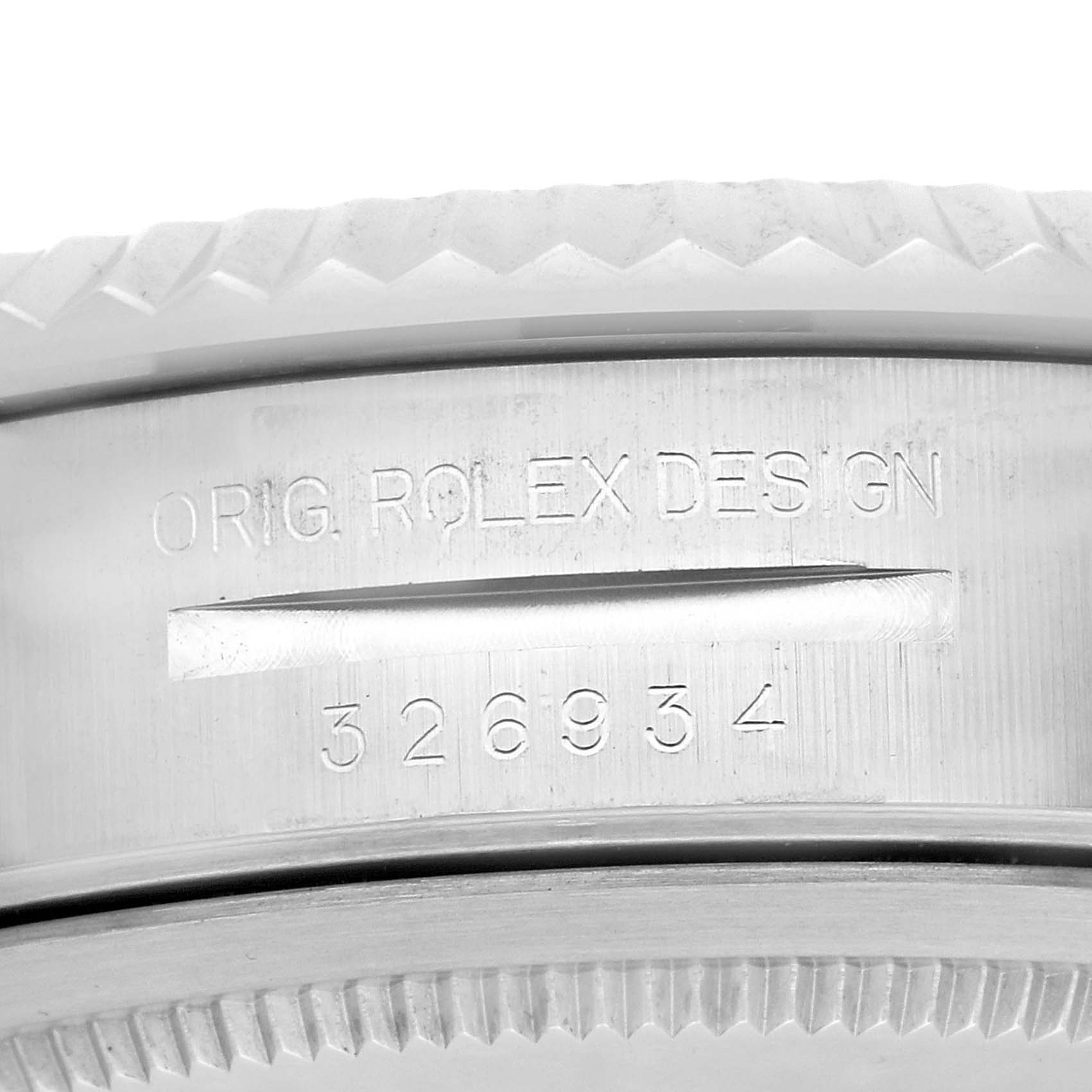 The image shows a close-up of the side of a Rolex Sky-Dweller 326934 Men
s Stainless Steel Blue Dial watch, featuring the engraved original design and model number.