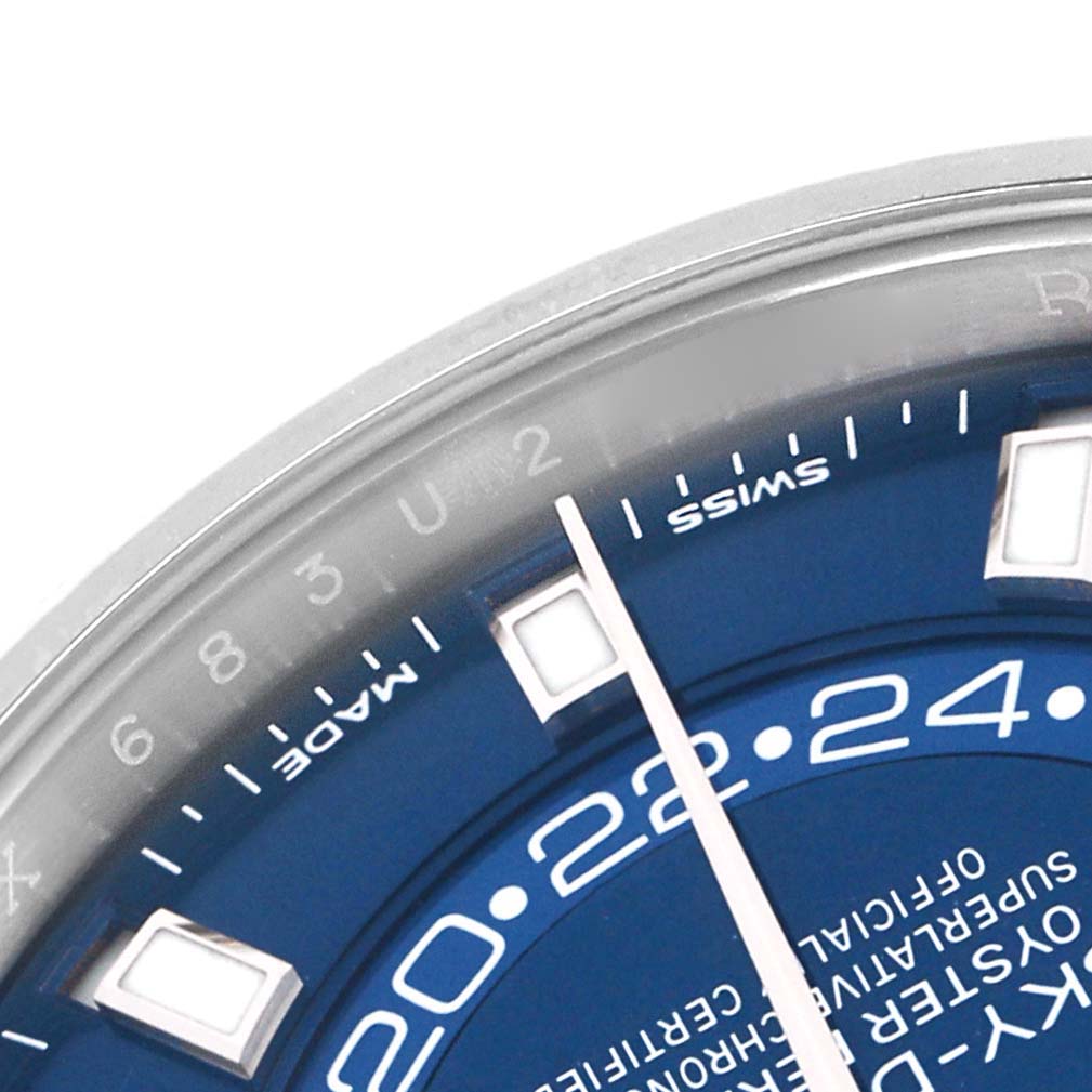The image shows a close-up of the Rolex Sky-Dweller 326934 Men
s Stainless Steel Blue Dial
s blue dial, hour markers, and part of the bezel.