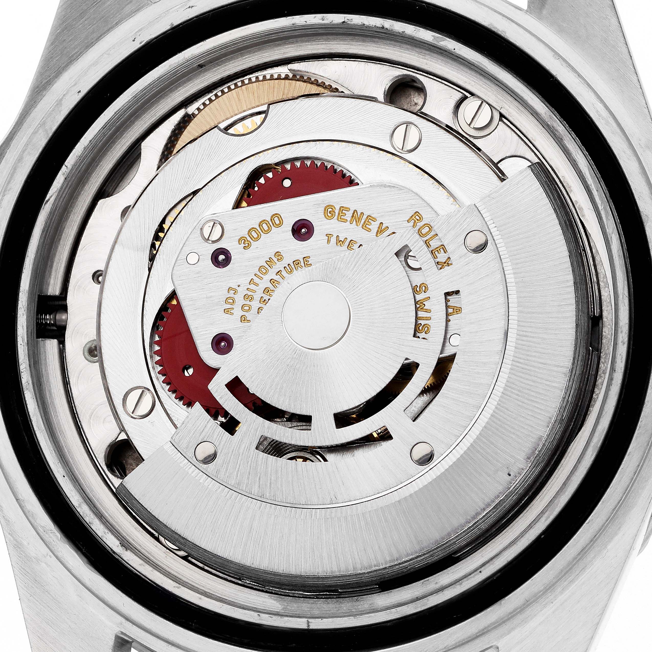 The image shows the movement of a Rolex Submariner 14060 Men
s Stainless Steel Black Dial watch from a rear angle, highlighting its intricate mechanical parts.