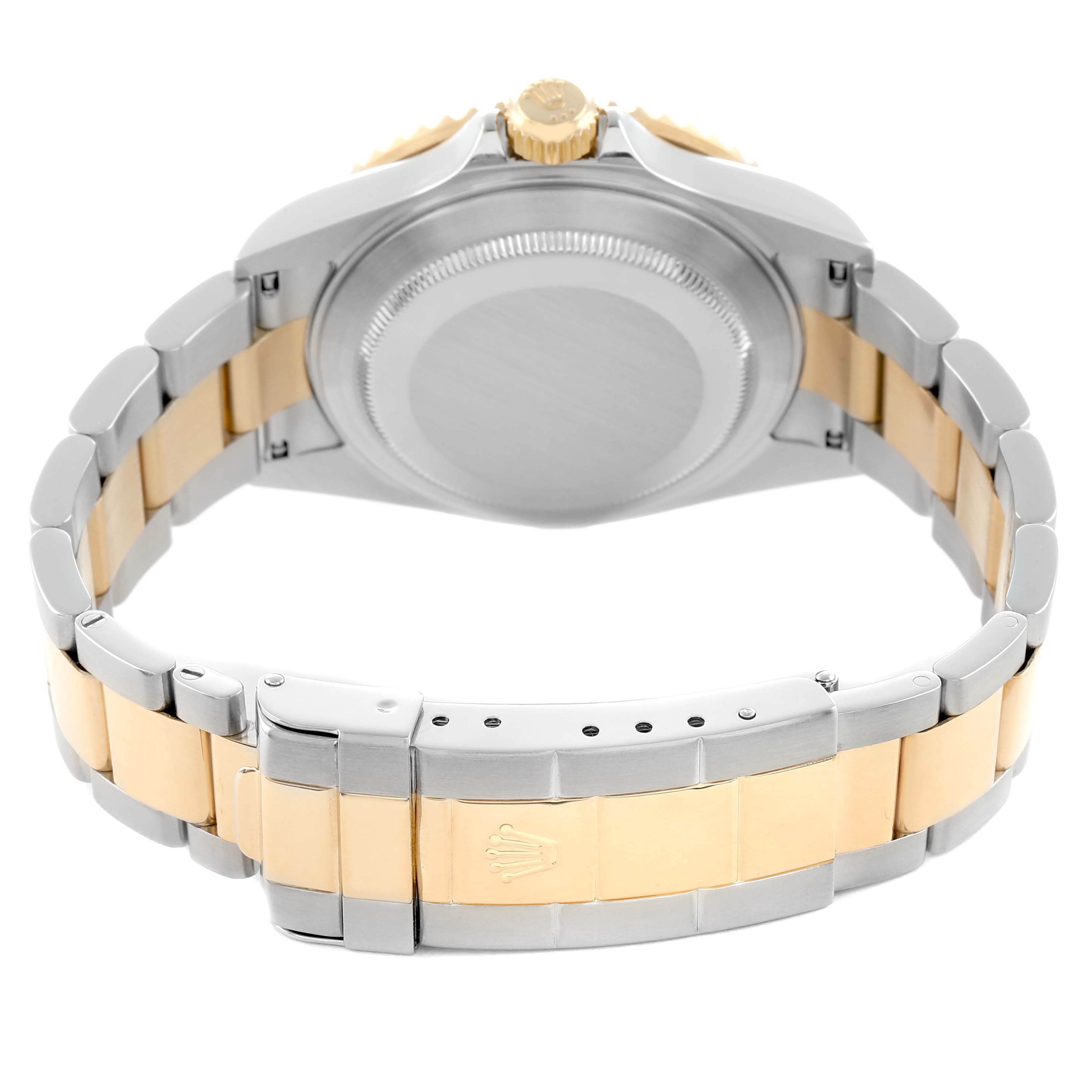 The image shows the back and bracelet of a Rolex Submariner 16613 Men
s Steel and Gold (two tone) Black Dial, highlighting its two-tone links and clasp with the logo.