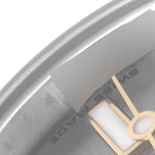 This is a close-up of the Rolex Yacht-Master 169623 Women's Steel and Gold (two tone) Grey Dial 169623 Women's Steel and Gold (two tone) Grey Dial watch, showing part of the bezel, dial, and a hand.