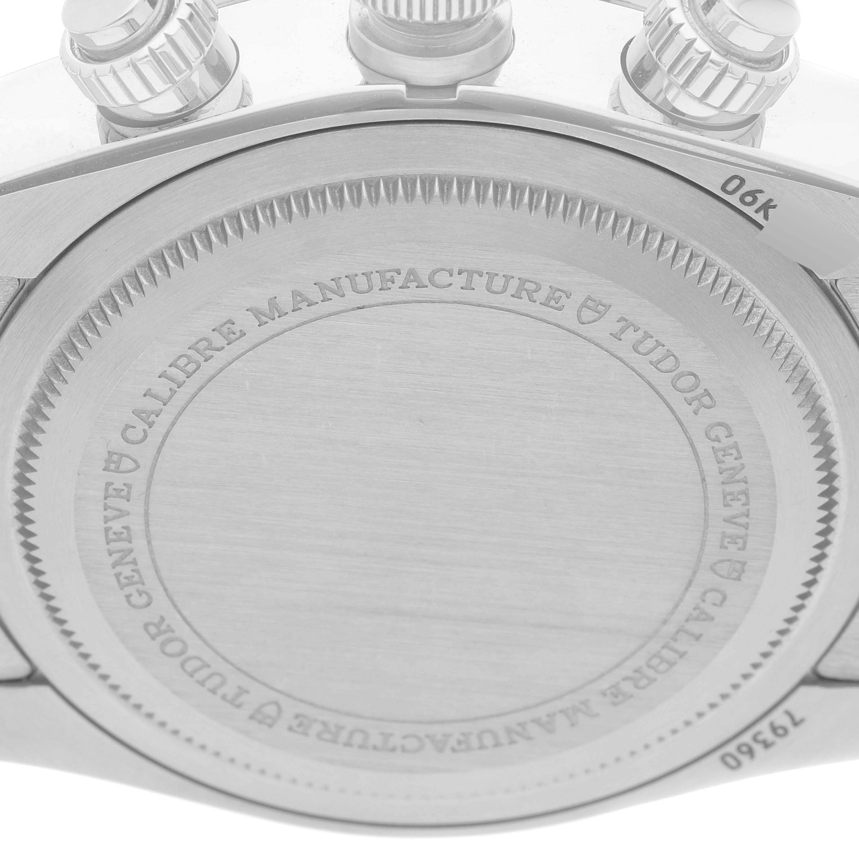 The image shows the back case of a Tudor Heritage Black Bay M79360N-0002 Men's Stainless Steel Silver Dial M79360N-0002 Men's Stainless Steel Silver Dial watch, focusing on the engravings and part of the crown.