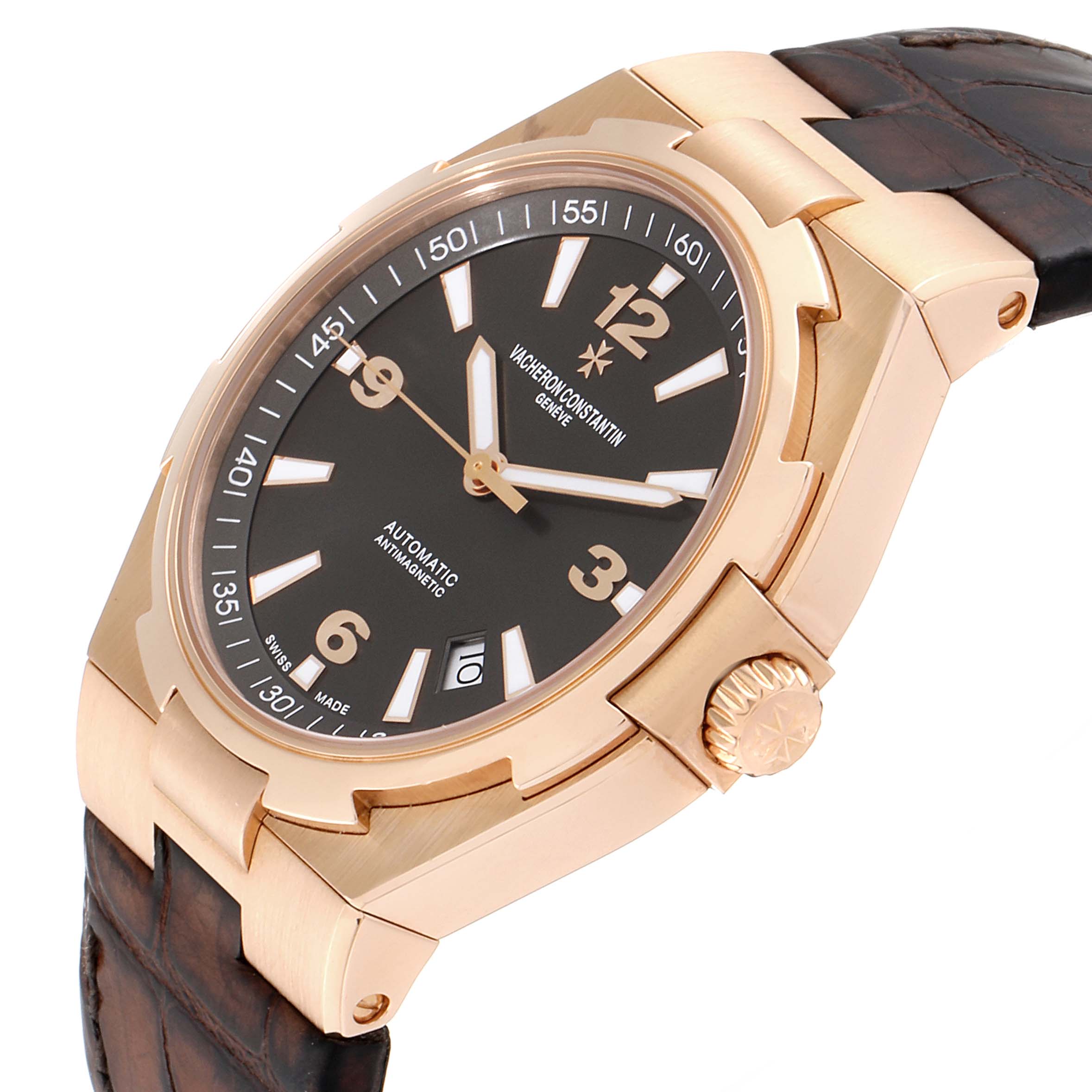 The image shows a Vacheron Constantin Overseas 47040/000R-9666 Men's Rose Gold Black Dial 47040/000R-9666 Men's Rose Gold Black Dial watch, highlighting its dial, crown, and leather strap from an angled side view.