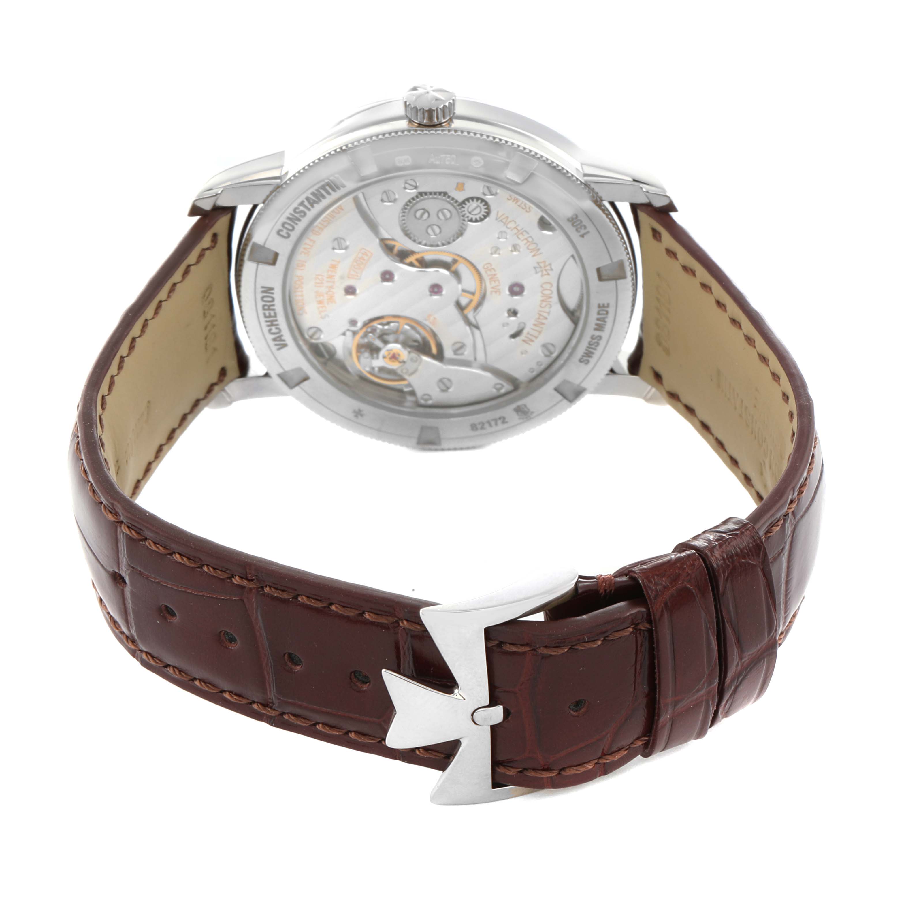 The image shows the Vacheron Constantin Traditionnelle 82172G Men's White Gold Silver Dial watch from the back, highlighting the movement and brown leather strap with clasp.