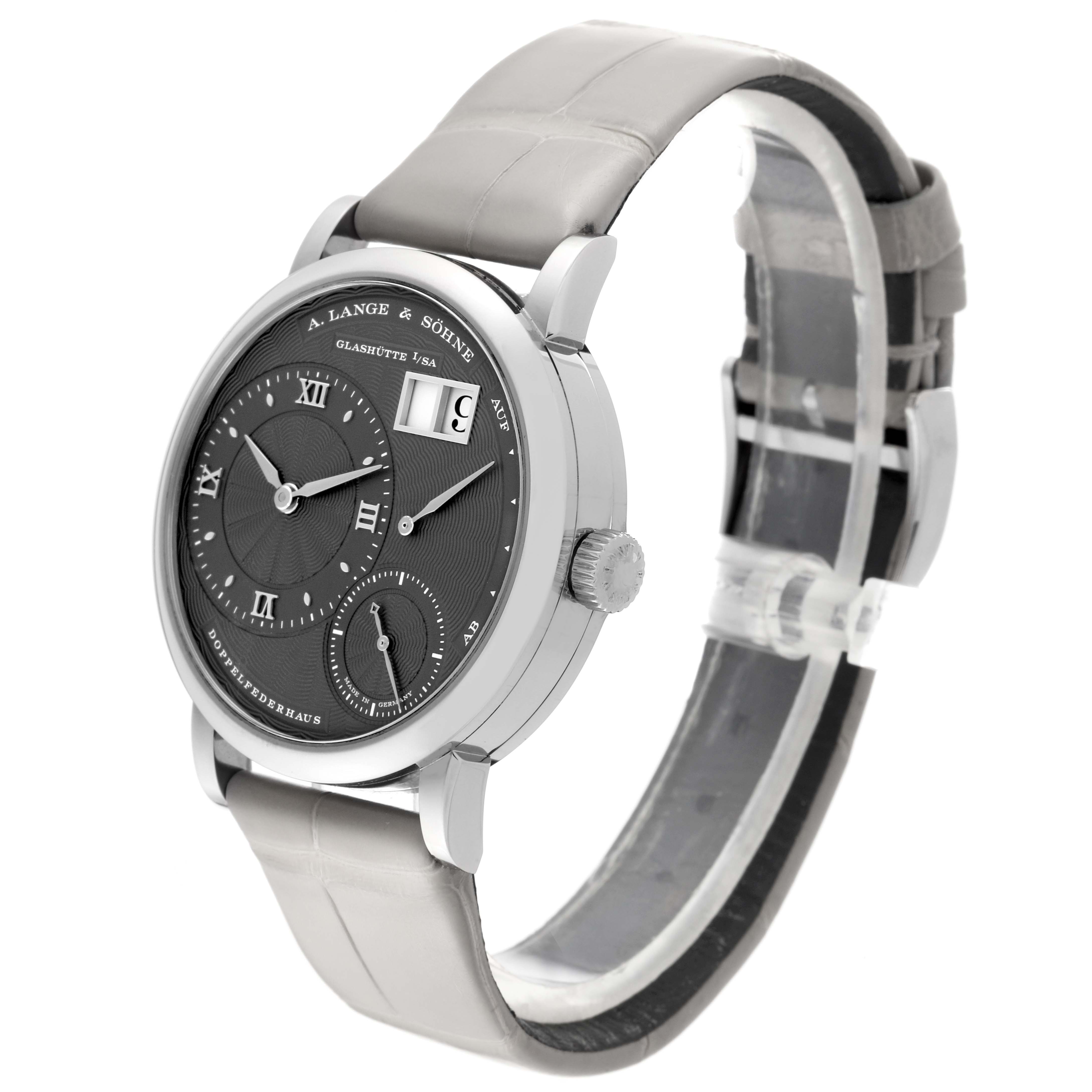 The Lange 1 model by A. Lange & Söhne is shown at a slight angle, displaying the dial, casing, crown, and leather strap.