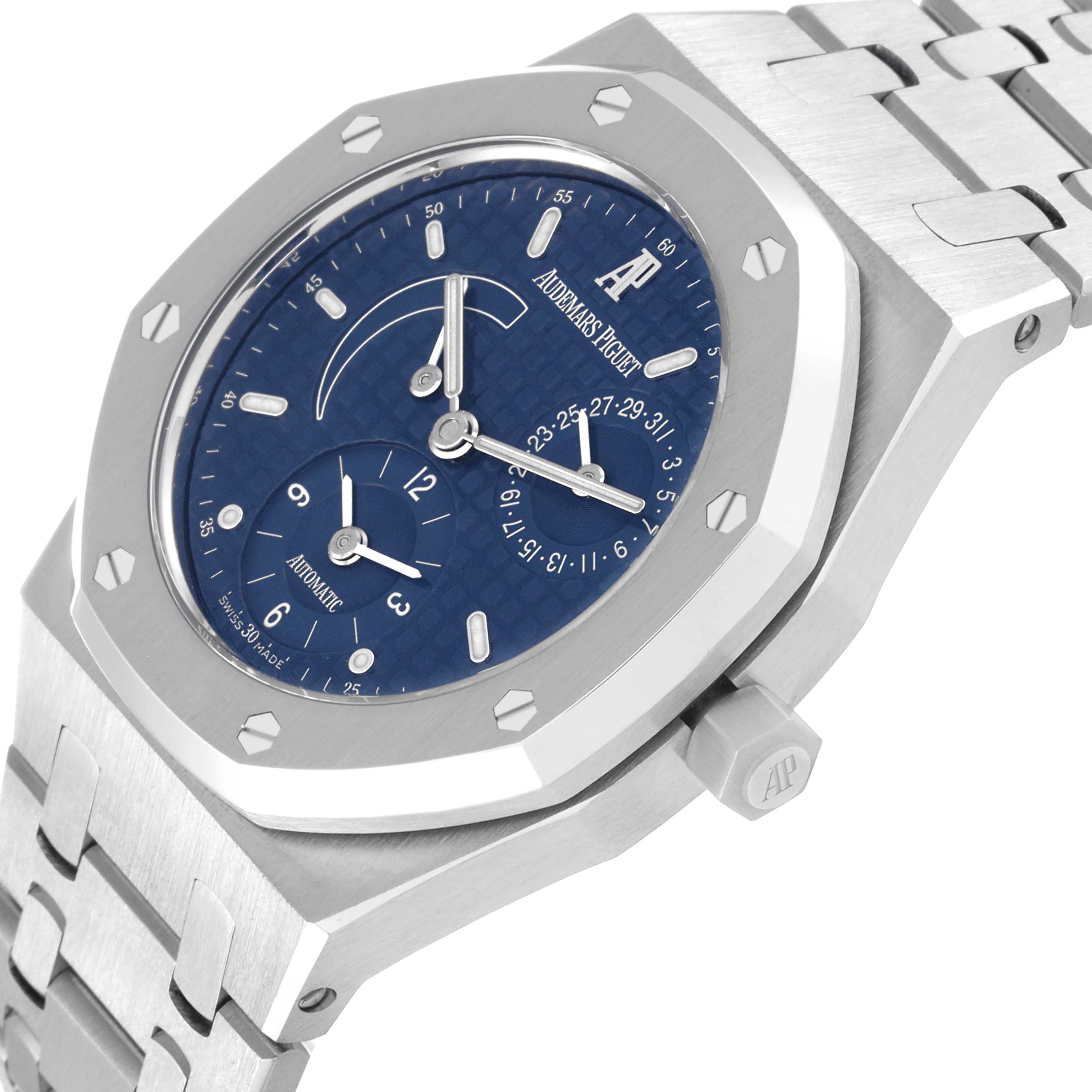 The image shows a close-up, angled view of the Audemars Piguet Royal Oak 25730ST Men's Stainless Steel Blue Dial 25730ST Men's Stainless Steel Blue Dial watch, featuring its face, bezel, crown, and part of the bracelet.