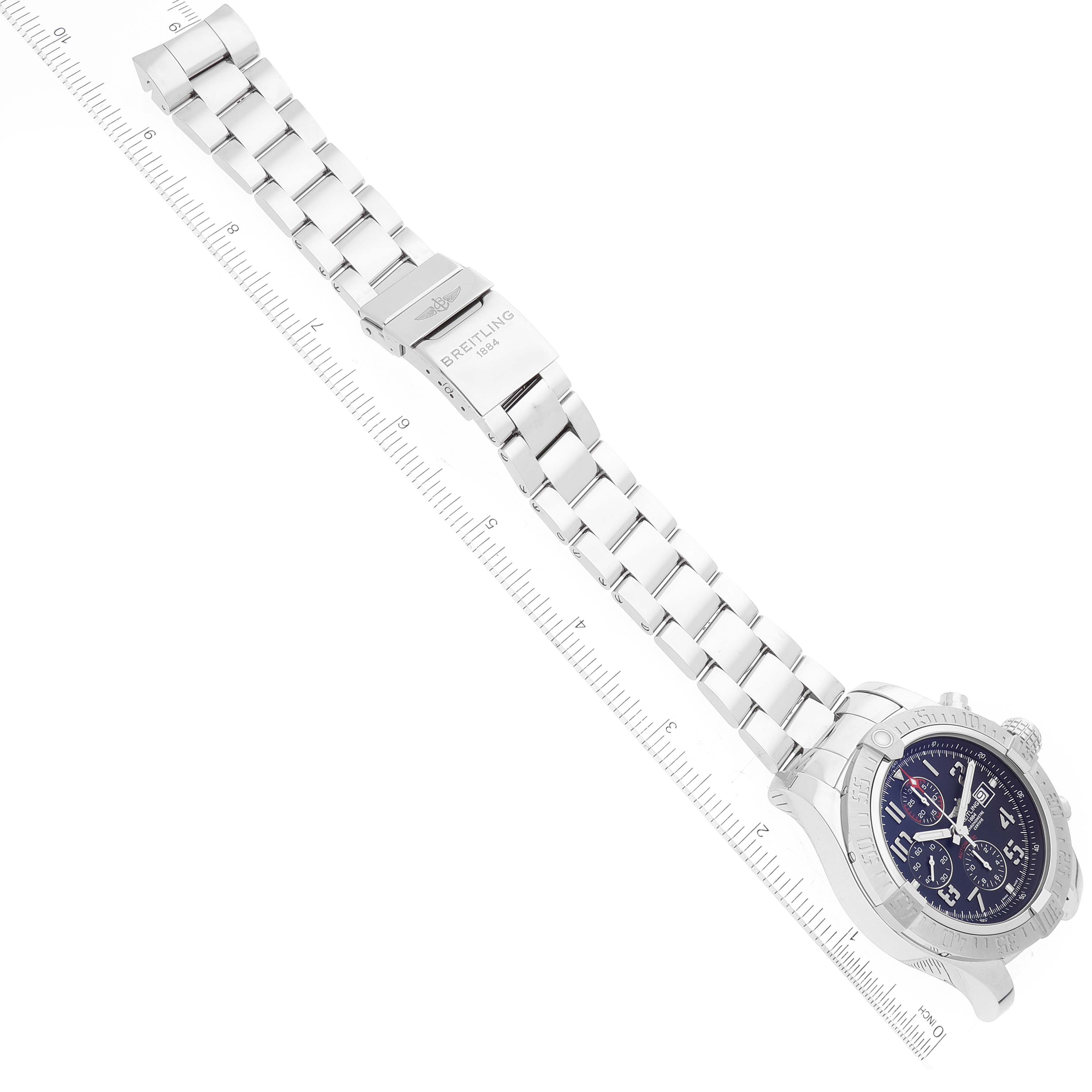 This image shows the Avenger model by Breitling laid flat, featuring the watch face, bracelet, and clasp, captured from a top-down angle.