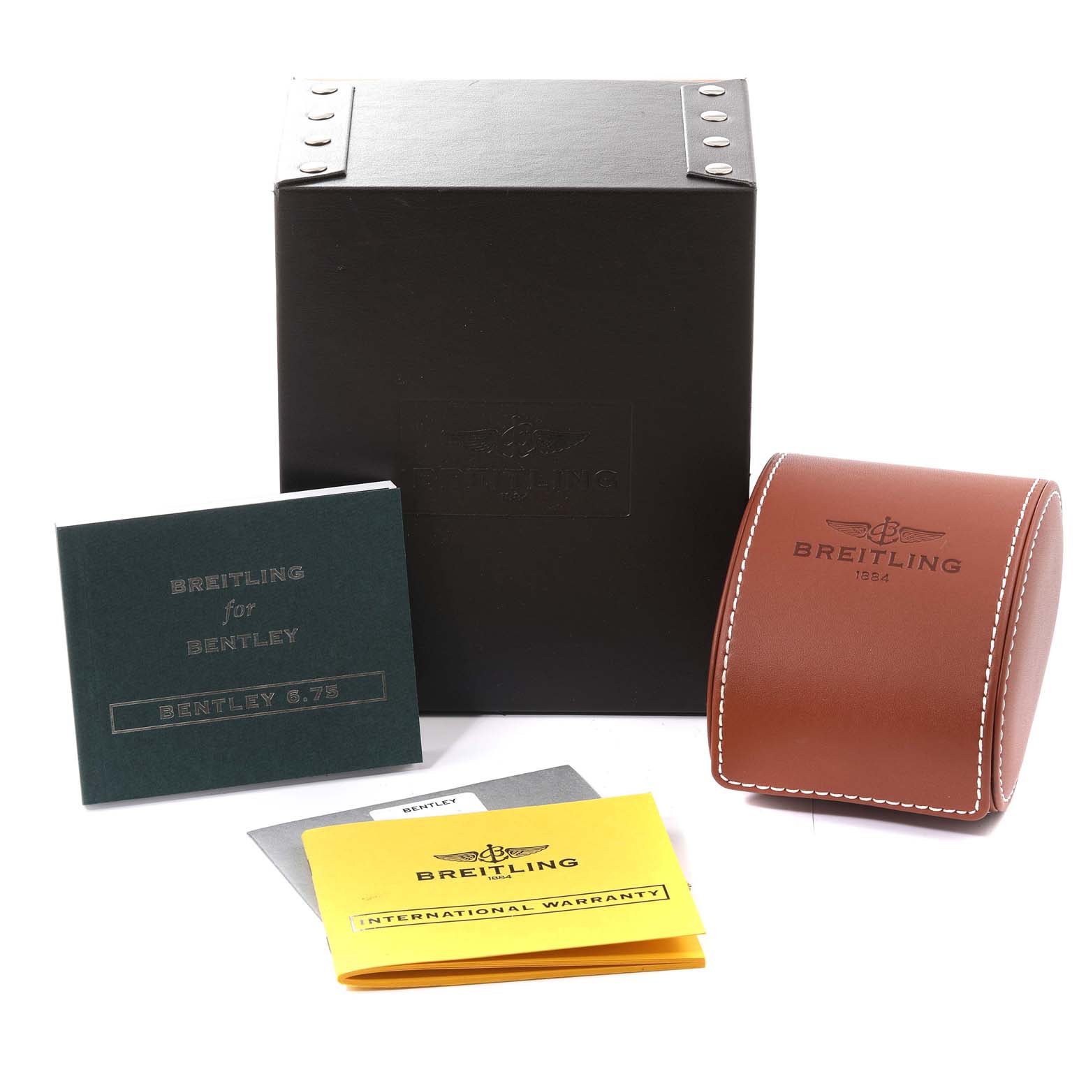 The image shows Breitling Bentley A44364 Men's Stainless Steel Black Dial A44364 Men's Stainless Steel Black Dial watch accessories, including a black box, a brown leather case, manuals, and an international warranty.