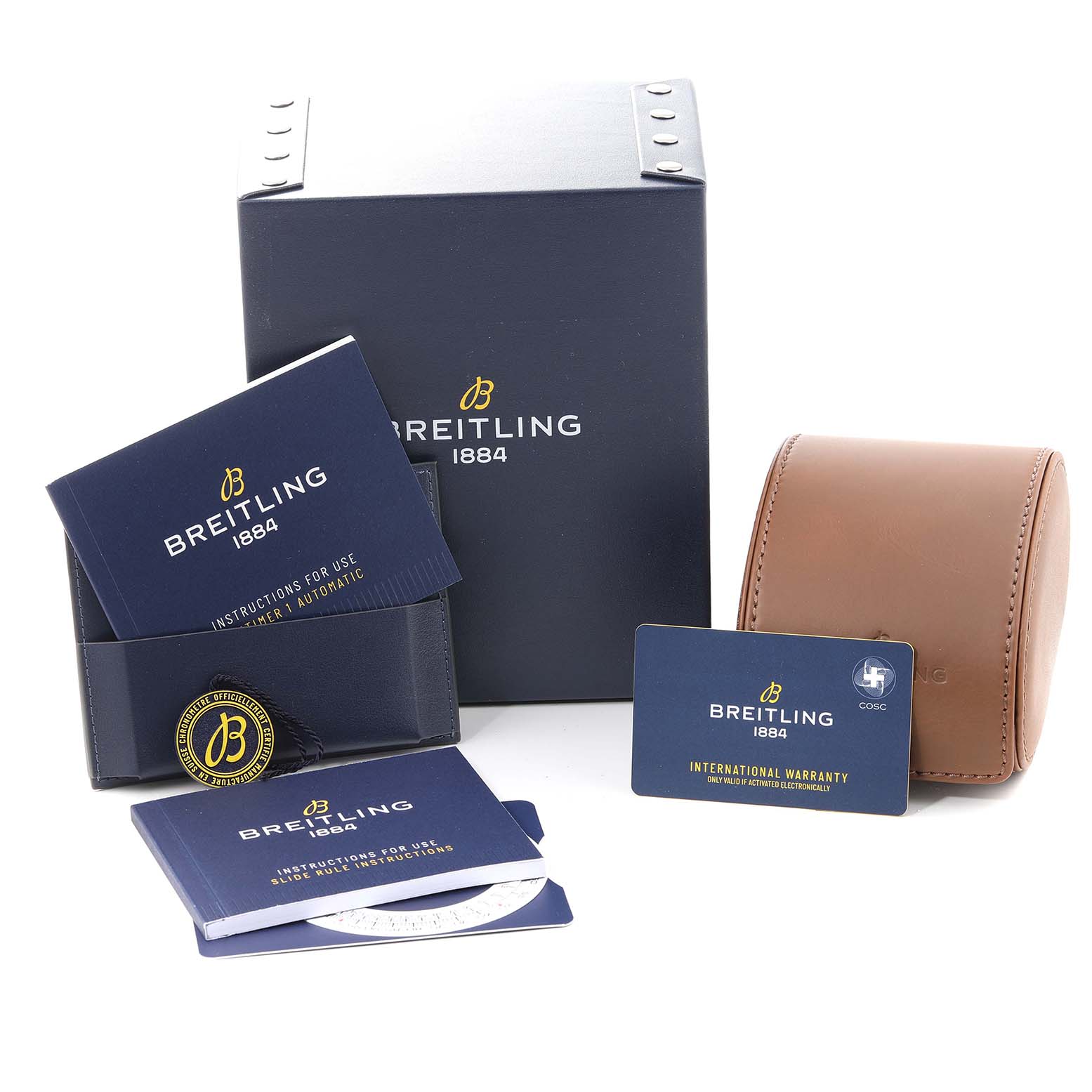 This image shows the packaging and accessories for a Breitling Navitimer U17326 Men
s Stainless Steel Grey Dial U17326 Men
s Stainless Steel Grey Dial watch, including the box, warranty card, manuals, and a leather case.