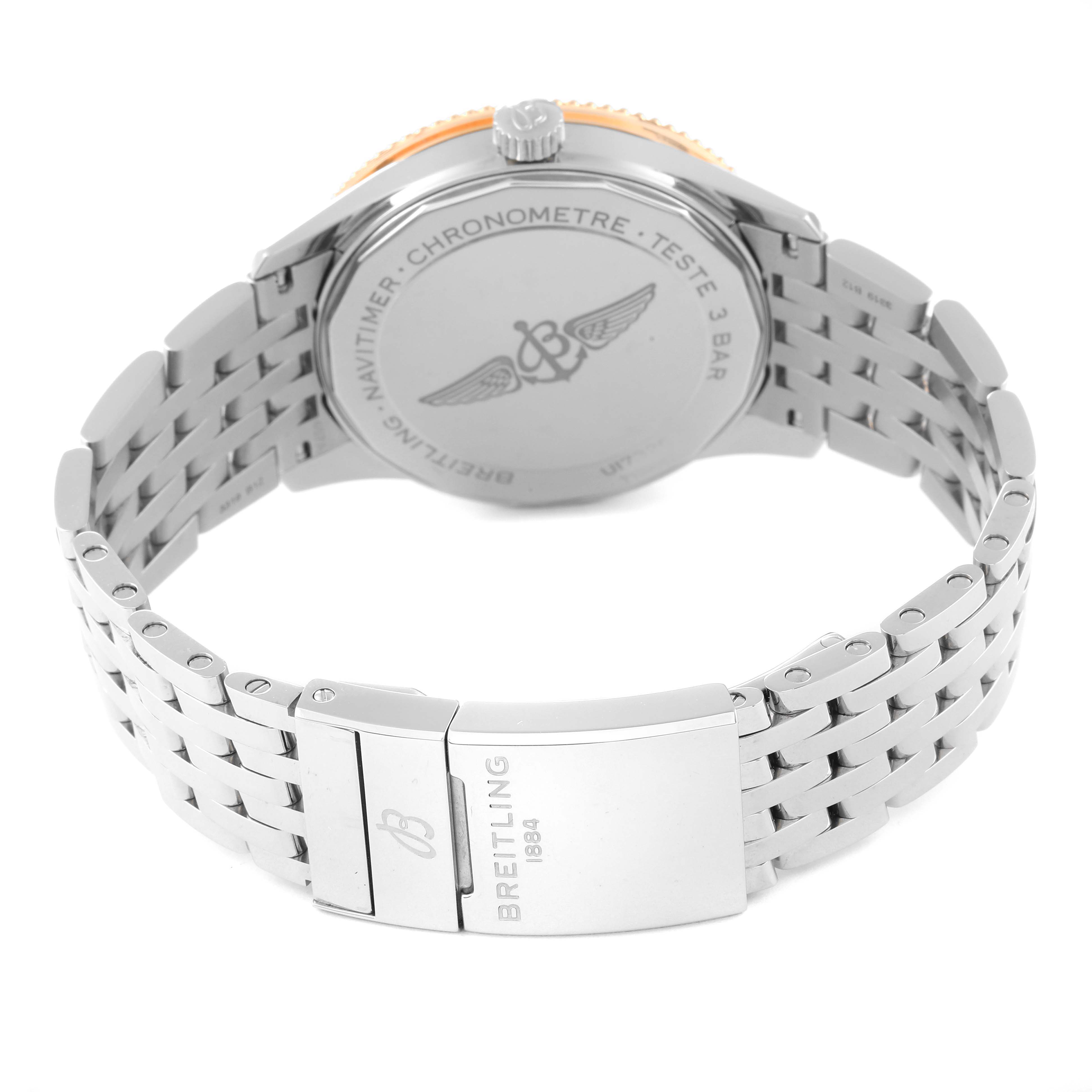 The image shows the back and bracelet of a Breitling Navitimer U17326 Men
s Stainless Steel Grey Dial U17326 Men
s Stainless Steel Grey Dial watch, highlighting the clasp and engraved case back.