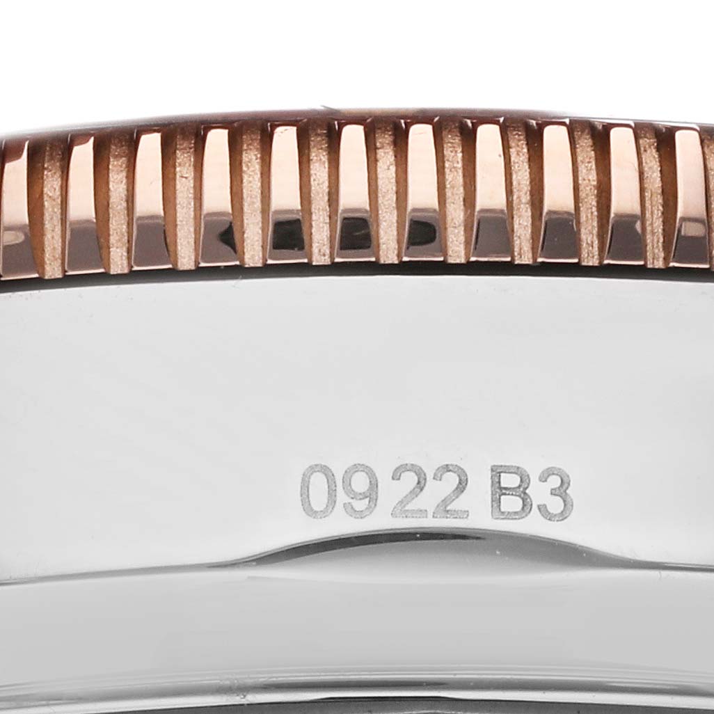 The image shows a close-up of the case back and the edge of the bezel of a Breitling Superocean UB2030121B1S1 Men
s Stainless Steel Black Dial UB2030121B1S1 Men
s Stainless Steel Black Dial watch.