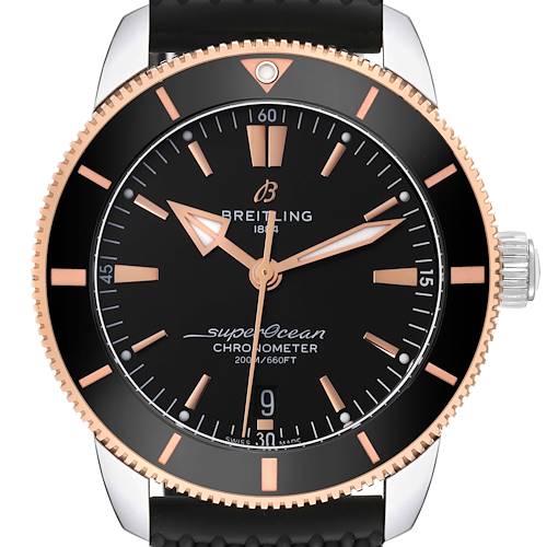 This Breitling Superocean watch is shown from a top-down angle, highlighting its black dial, rose gold markers, and bezel.