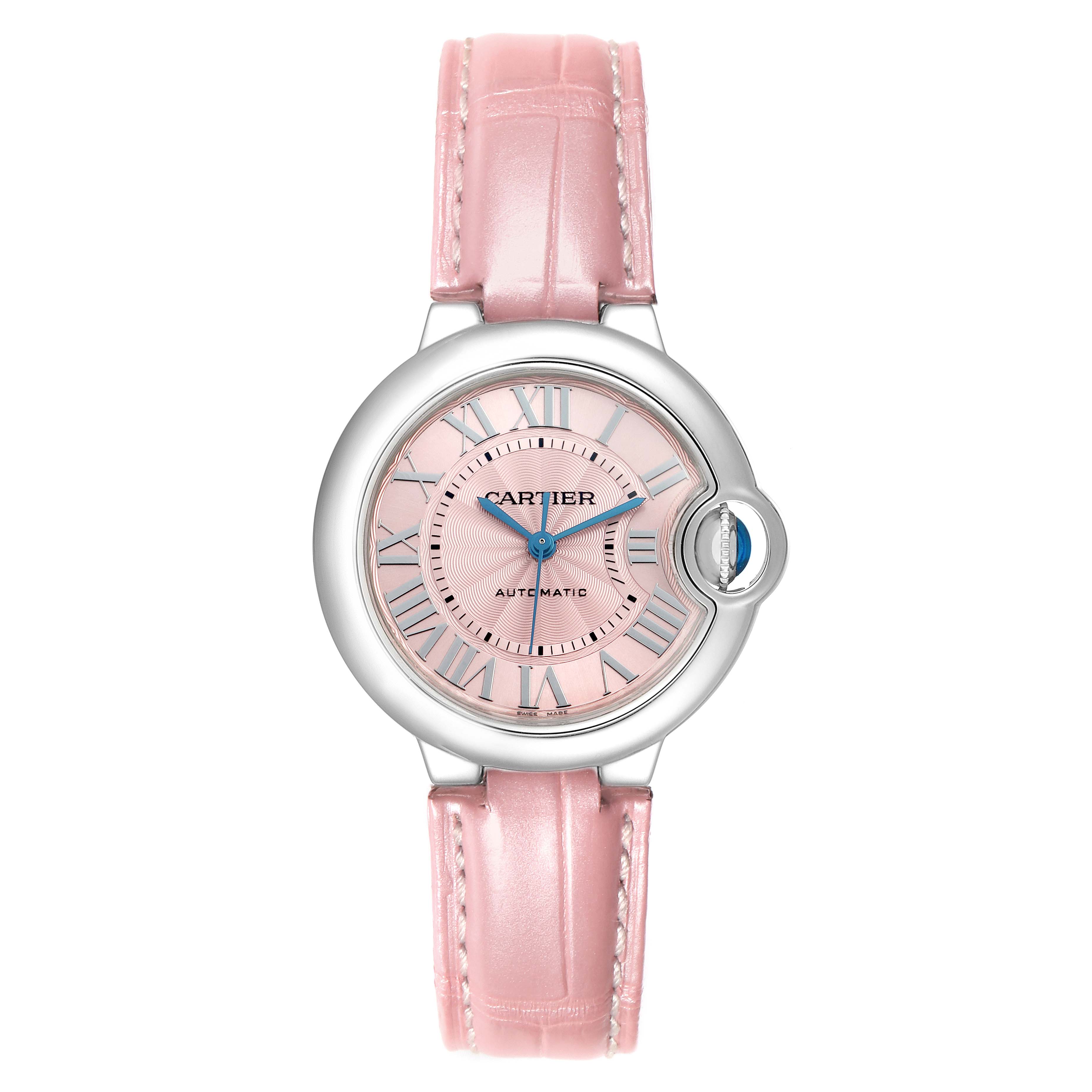The Ballon Bleu by Cartier is shown from a top-down angle, highlighting the pink dial, Roman numerals, and leather strap.