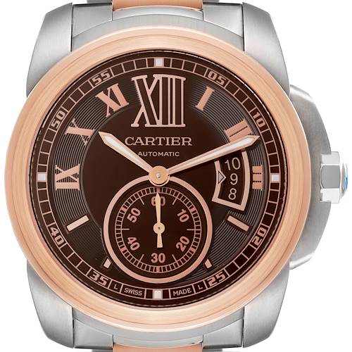 The watch, a Calibre de Cartier model by Cartier, is shown from a frontal angle, highlighting its dial, hands, and bezel.