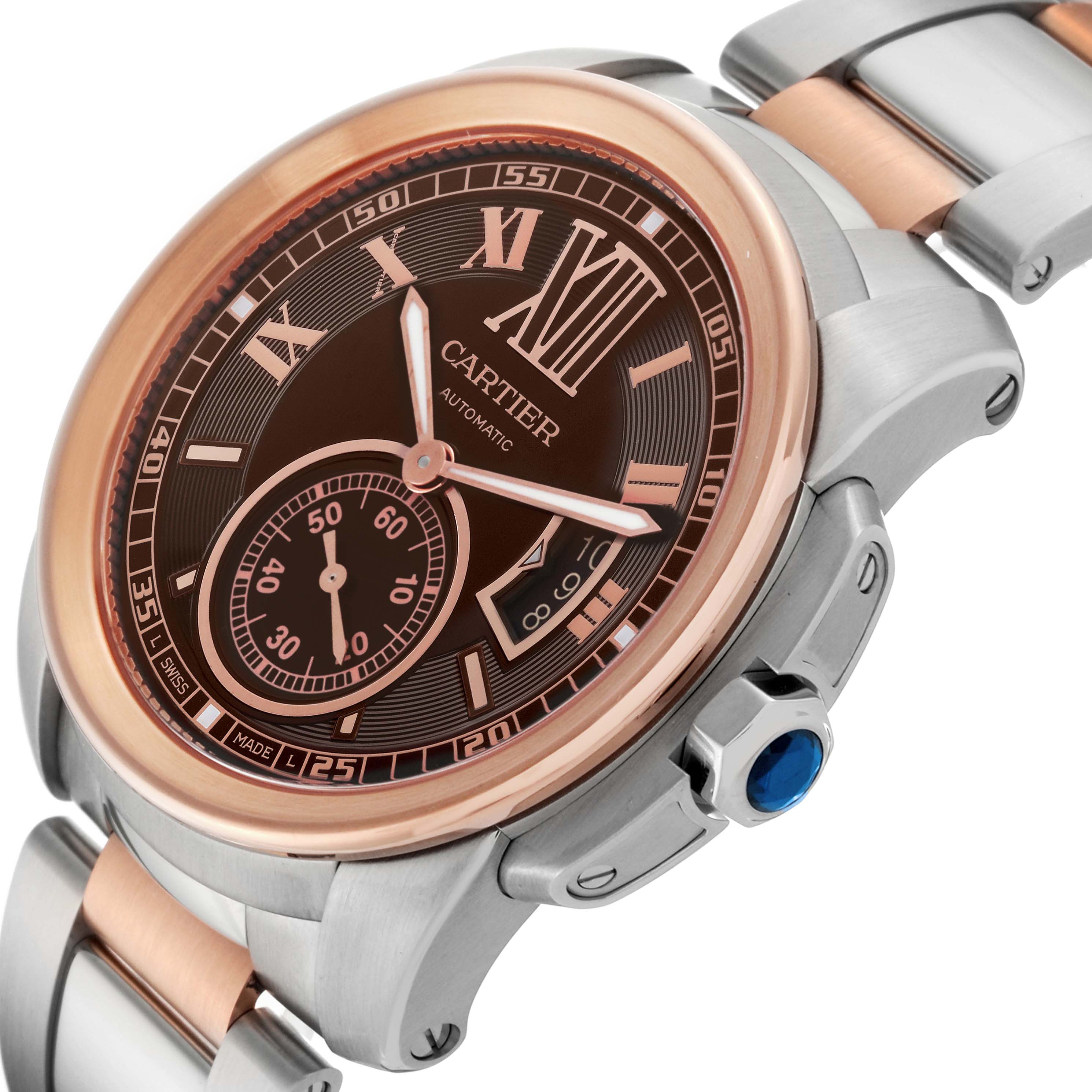 The image shows a close-up of the Calibre de Cartier watch by Cartier, highlighting the watch face, bezel, crown, and part of the bracelet.