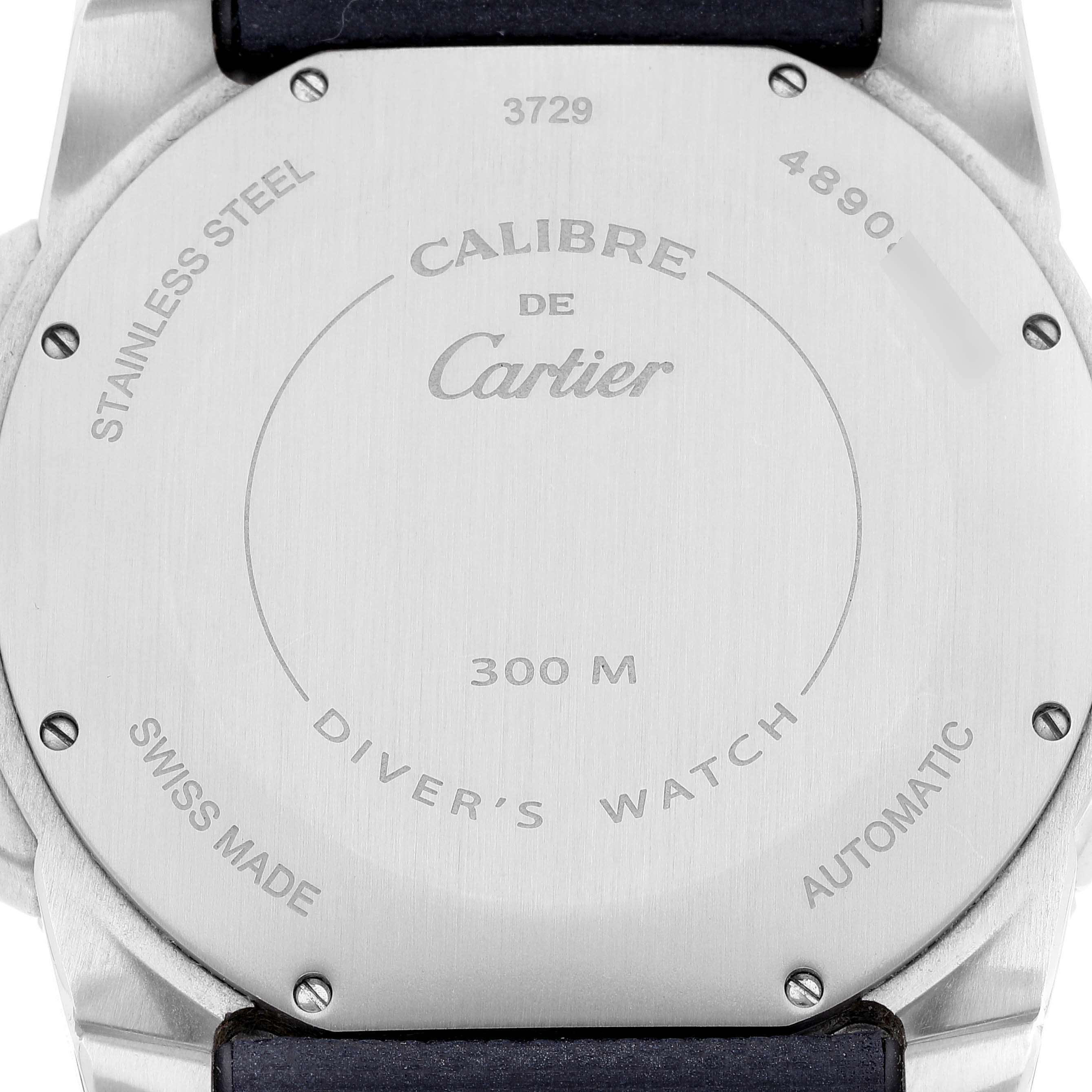 The image shows the back view of the Calibre de Cartier watch by Cartier, highlighting its stainless steel casing and engraved details.