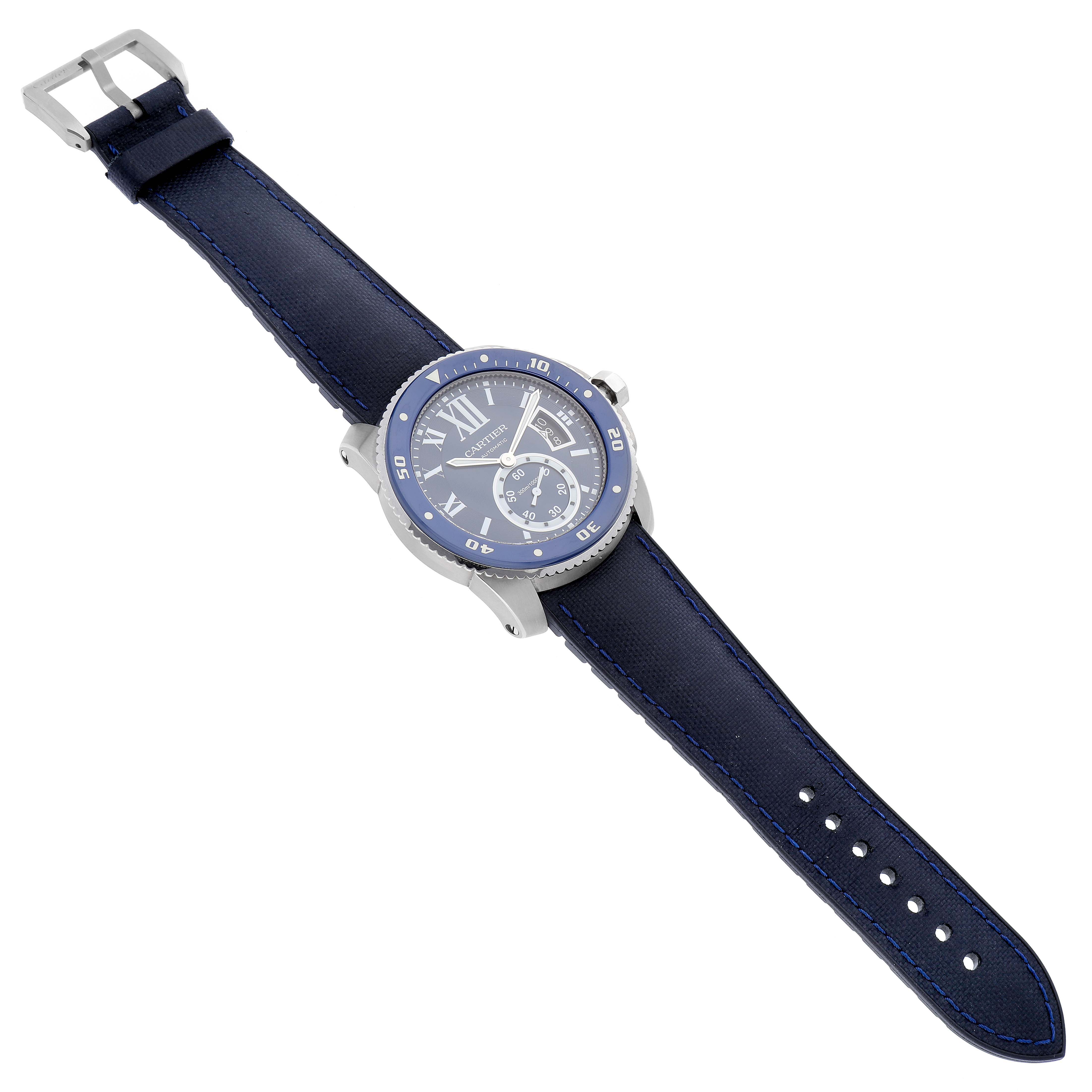 This image shows a Calibre de Cartier watch by Cartier at a top-down angle, displaying the face, strap, buckle, and case.