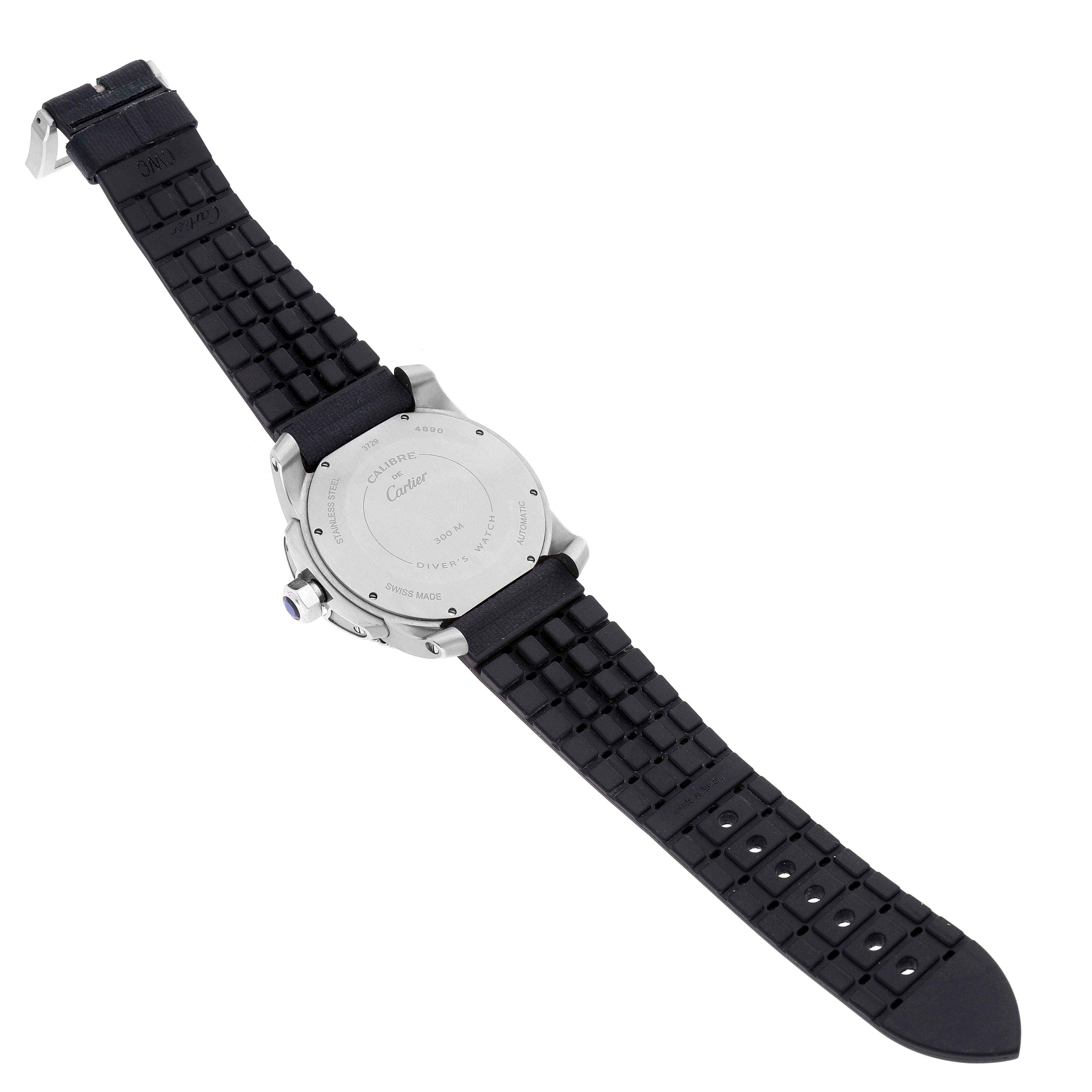 The image shows the back view of the Calibre de Cartier model by Cartier, highlighting the case back and the rubber watch strap.