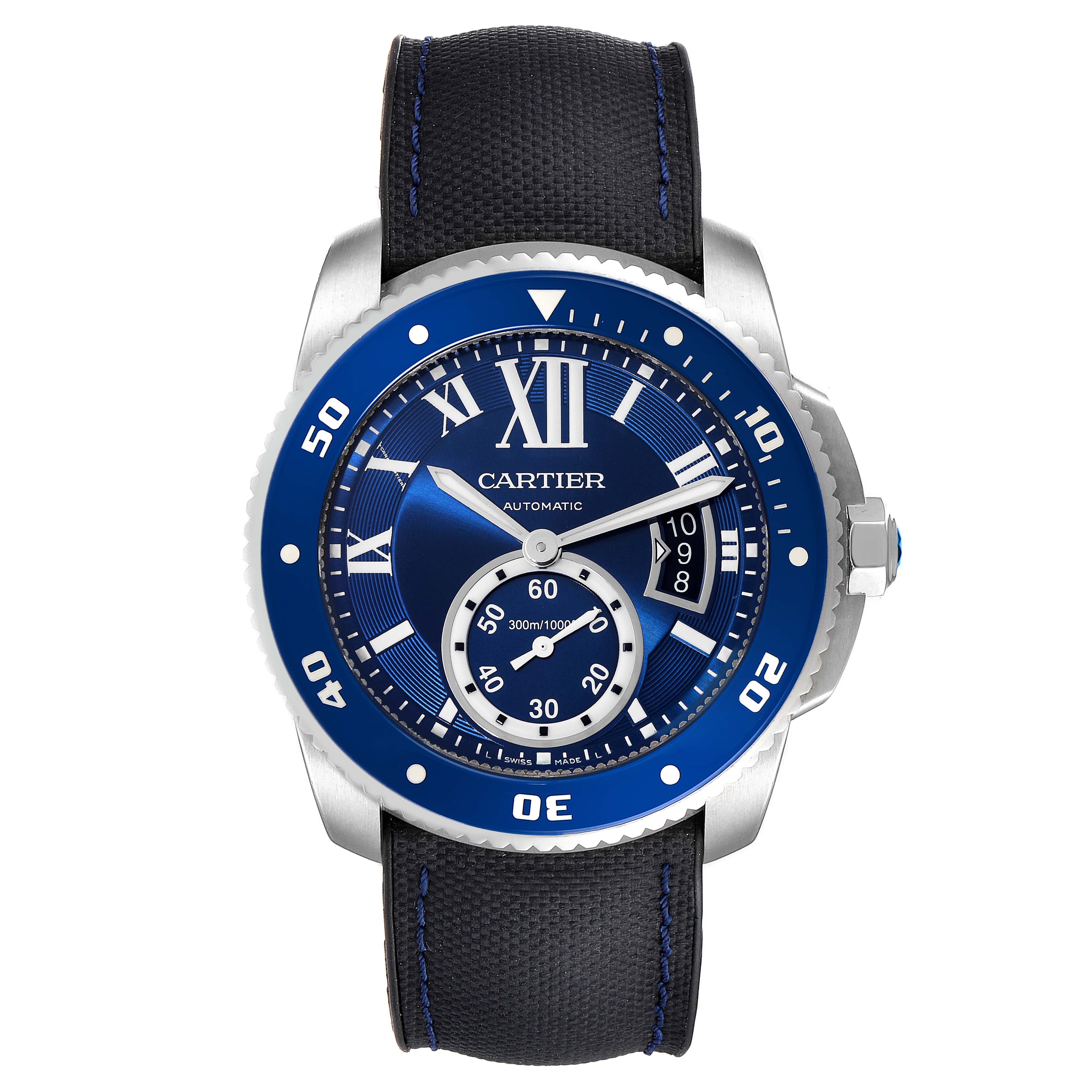 The image shows a Calibre de Cartier watch by Cartier from a front view, displaying its blue dial, bezel, and black strap.