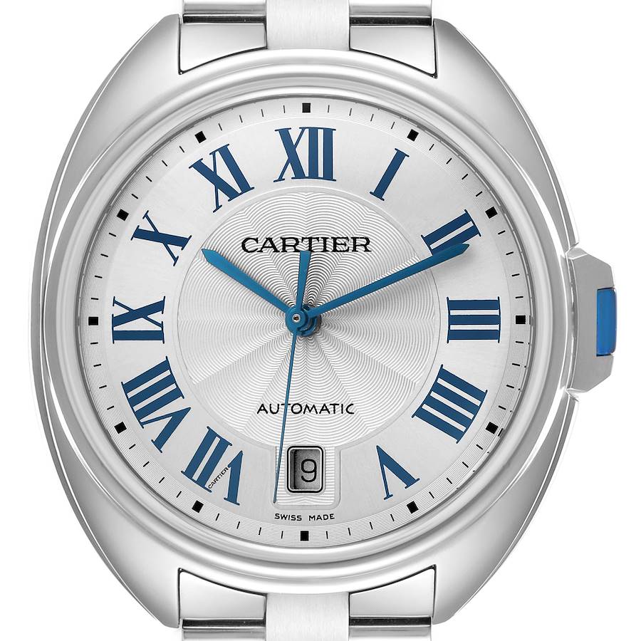 The Cartier Clé watch is shown from a front angle, highlighting the dial, Roman numerals, hands, and date window.