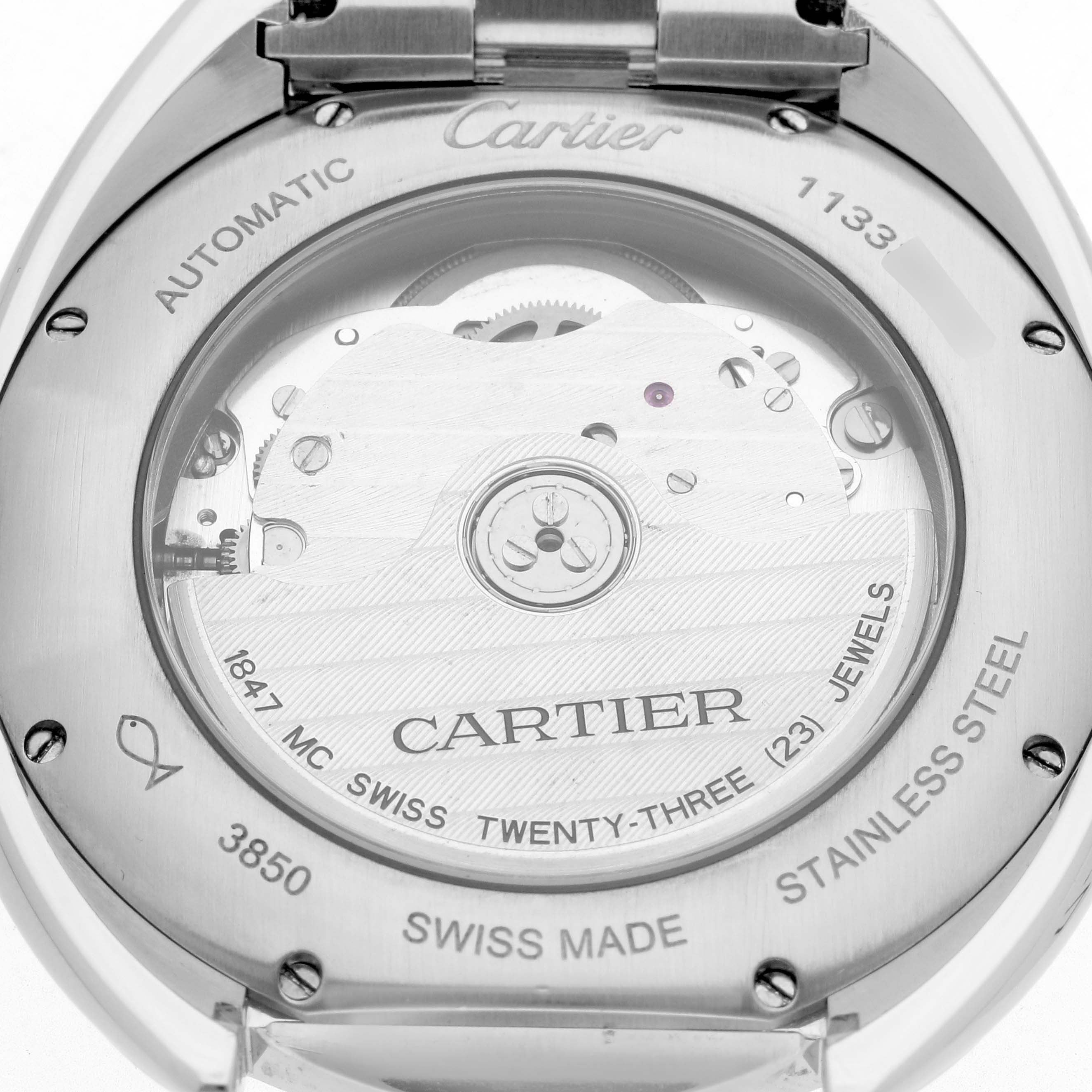 The image shows the back of a Cartier Clé watch, revealing the automatic movement and various inscriptions.