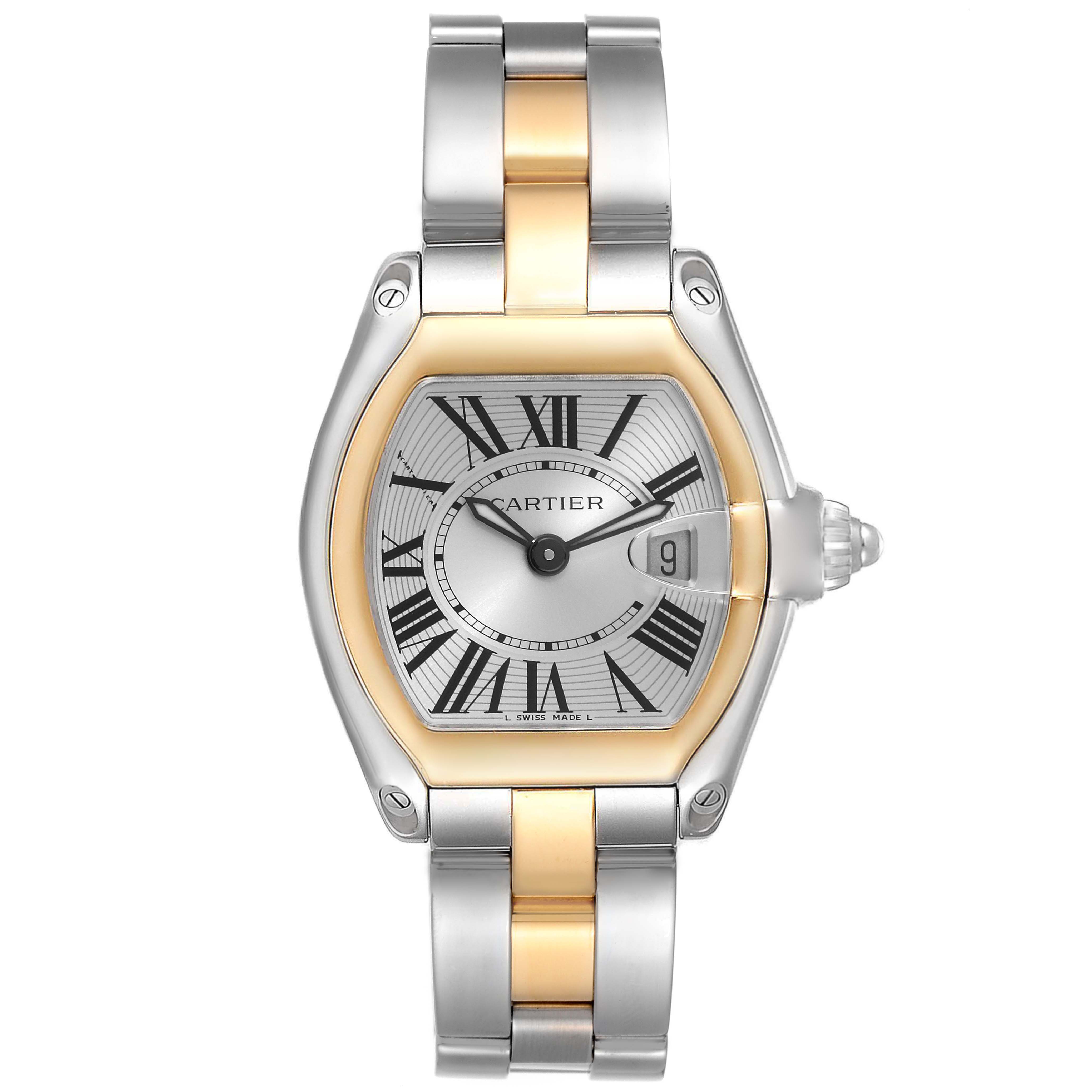 The image shows a Cartier Roadster W62026Y4 Women
s Steel and Gold (two tone) Silver Dial W62026Y4 Women
s Steel and Gold (two tone) Silver Dial model watch, featuring a two-tone metal bracelet, Roman numerals, and a date display at 3 o
clock.