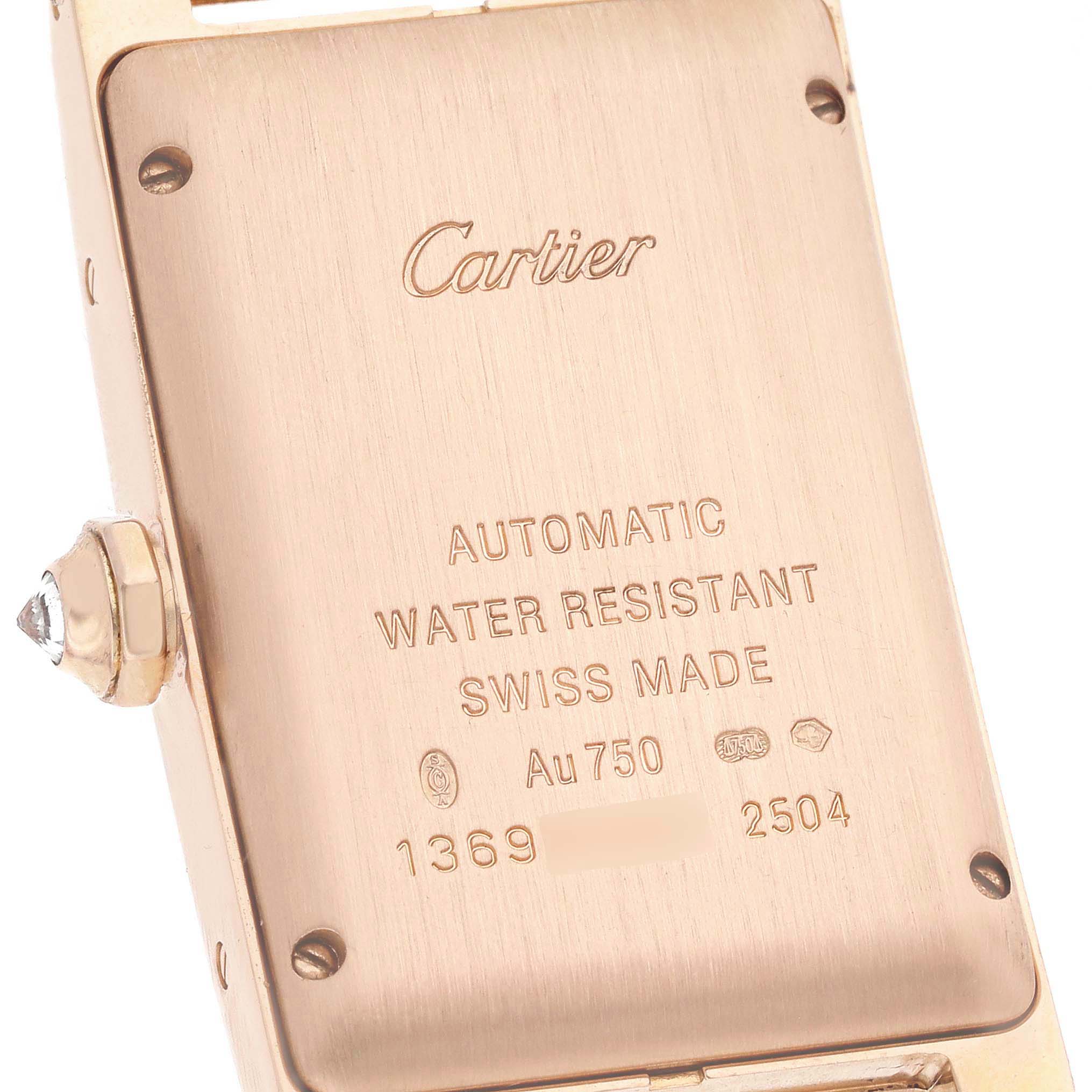 The image shows the back of the Cartier Tank Americaine WB704751 Women's Rose Gold Silver Dial watch, highlighting engravings and a side view of the crown with a gemstone.