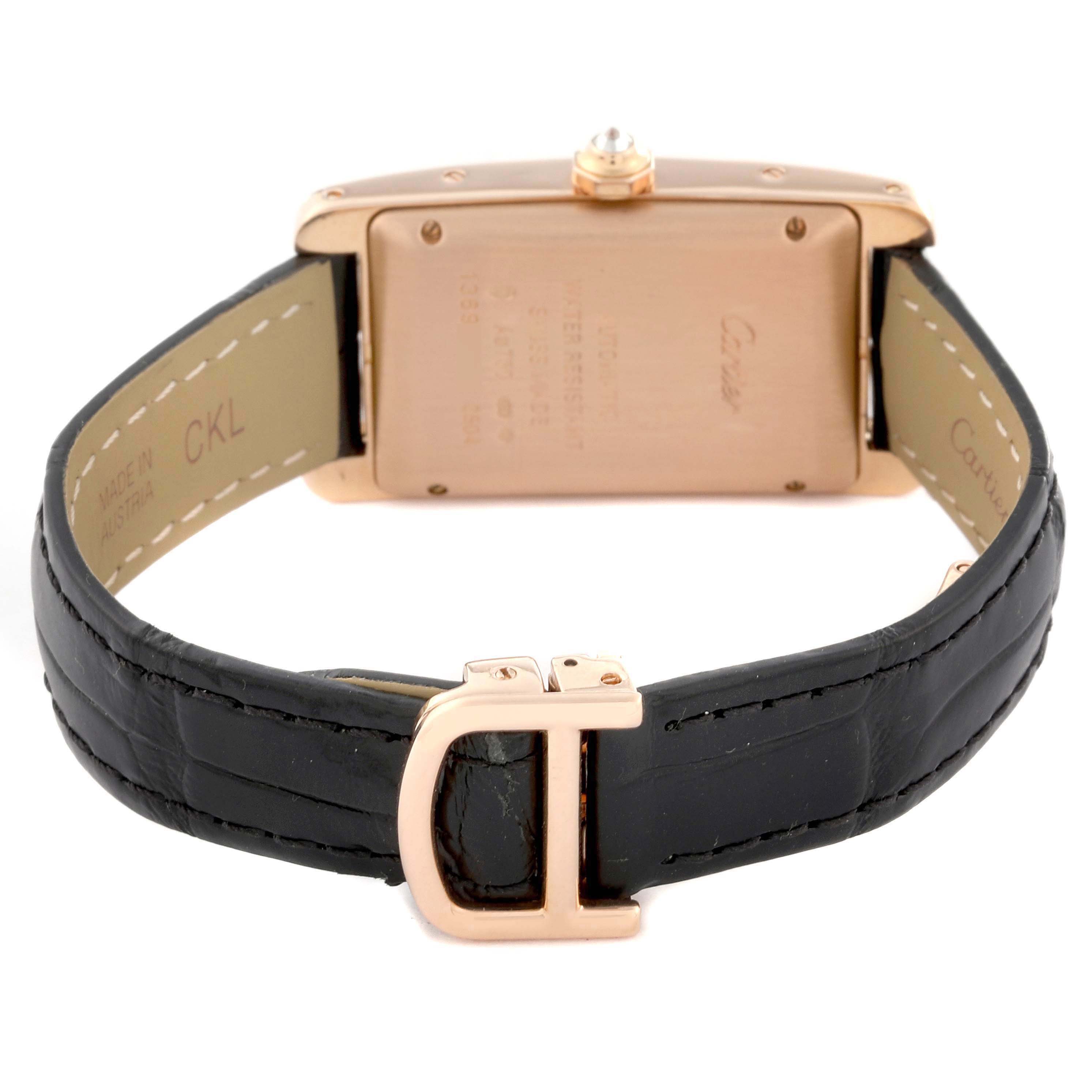 The image shows the back of a Cartier Tank Americaine WB704751 Women's Rose Gold Silver Dial watch, highlighting the case back, leather strap, and clasp.