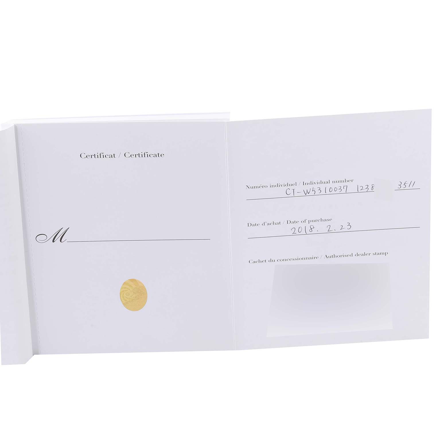 The image shows an open certificate booklet for a Tank Anglaise model by Cartier, displaying purchase details and a gold seal.