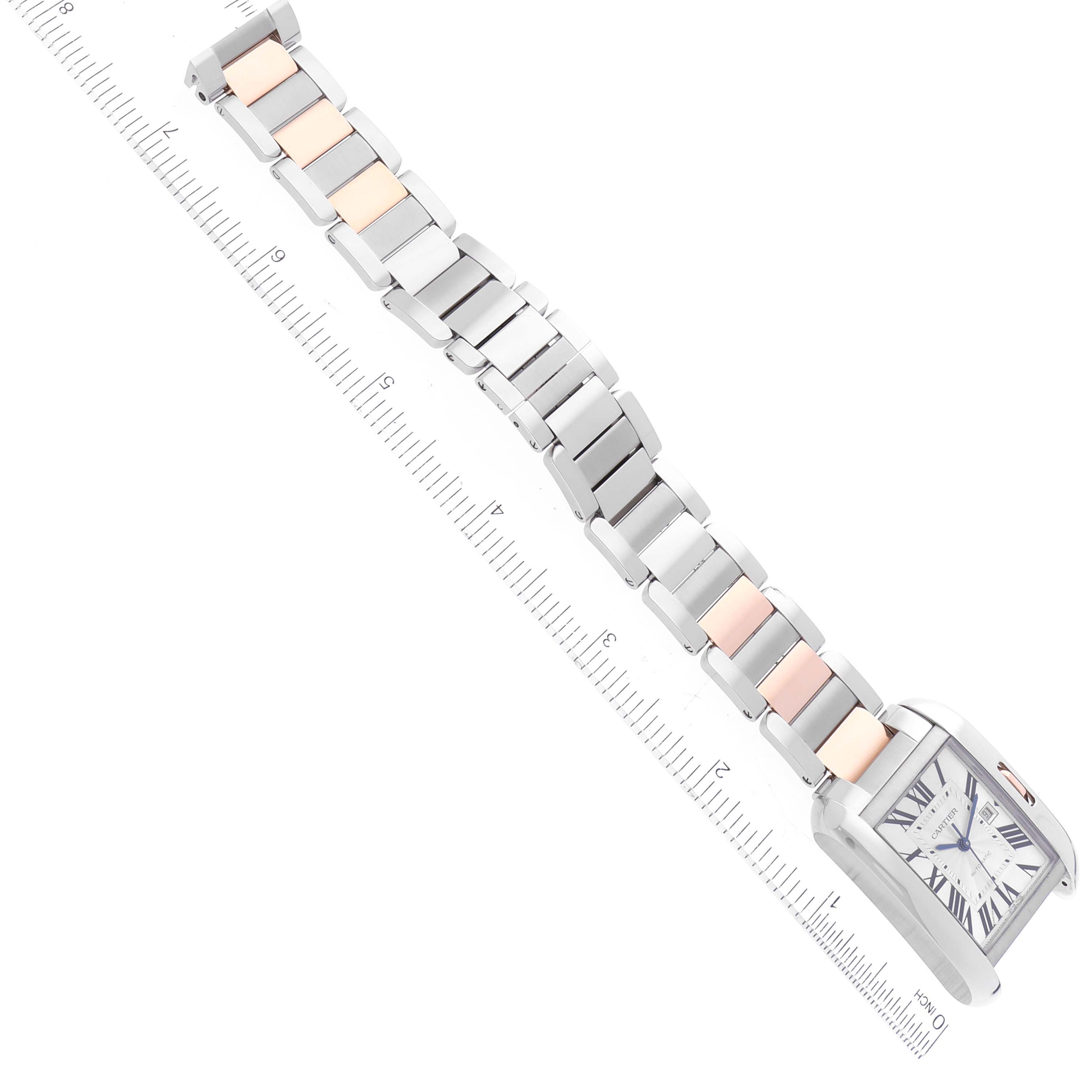 The image shows the Cartier Tank Anglaise W5310037 Men's Steel and Gold (two tone) Silver Dial W5310037 Men's Steel and Gold (two tone) Silver Dial watch laid flat with a ruler above it, highlighting its bracelet and face.