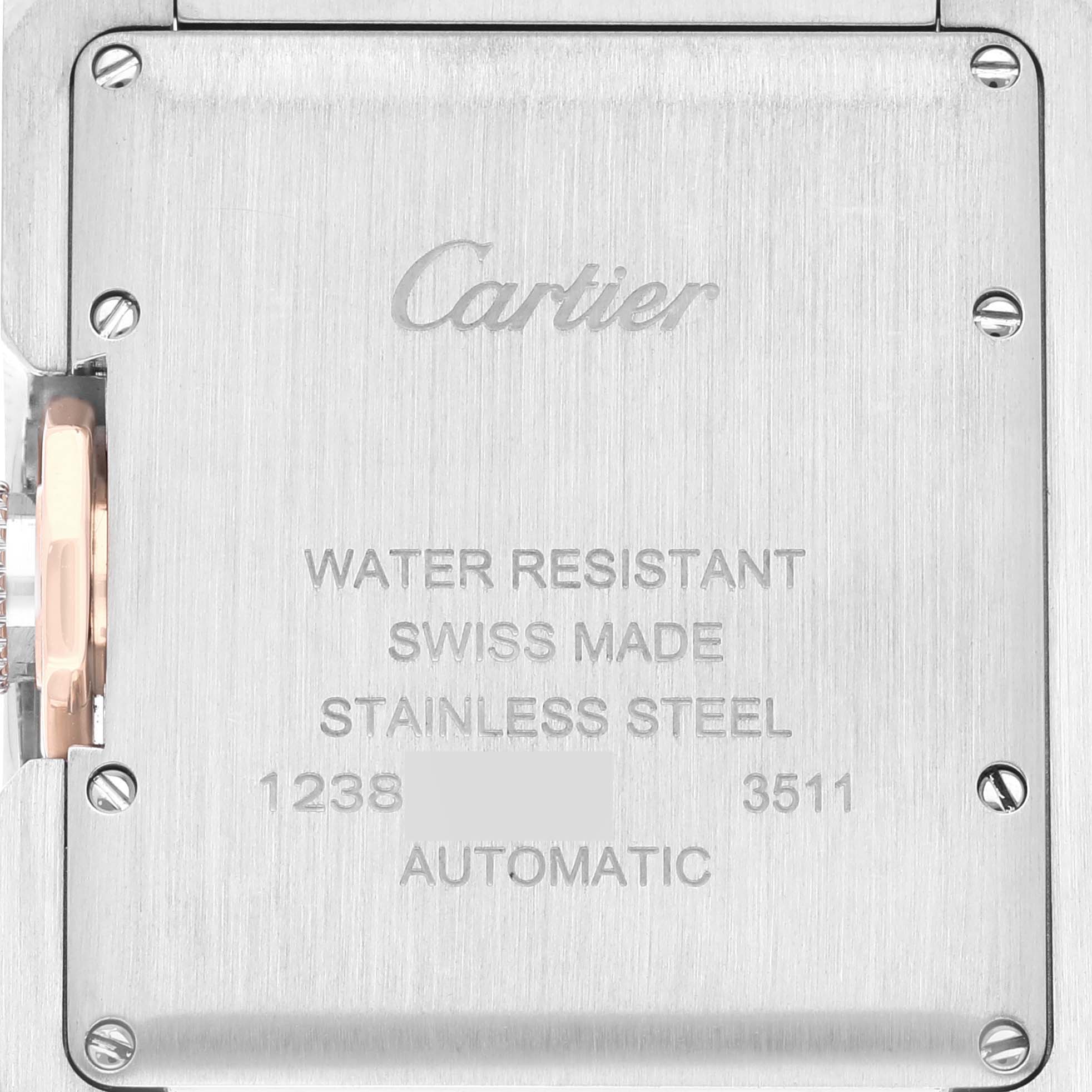 The image shows the back case of a Cartier Tank Anglaise W5310037 Men's Steel and Gold (two tone) Silver Dial W5310037 Men's Steel and Gold (two tone) Silver Dial watch with engraved details.