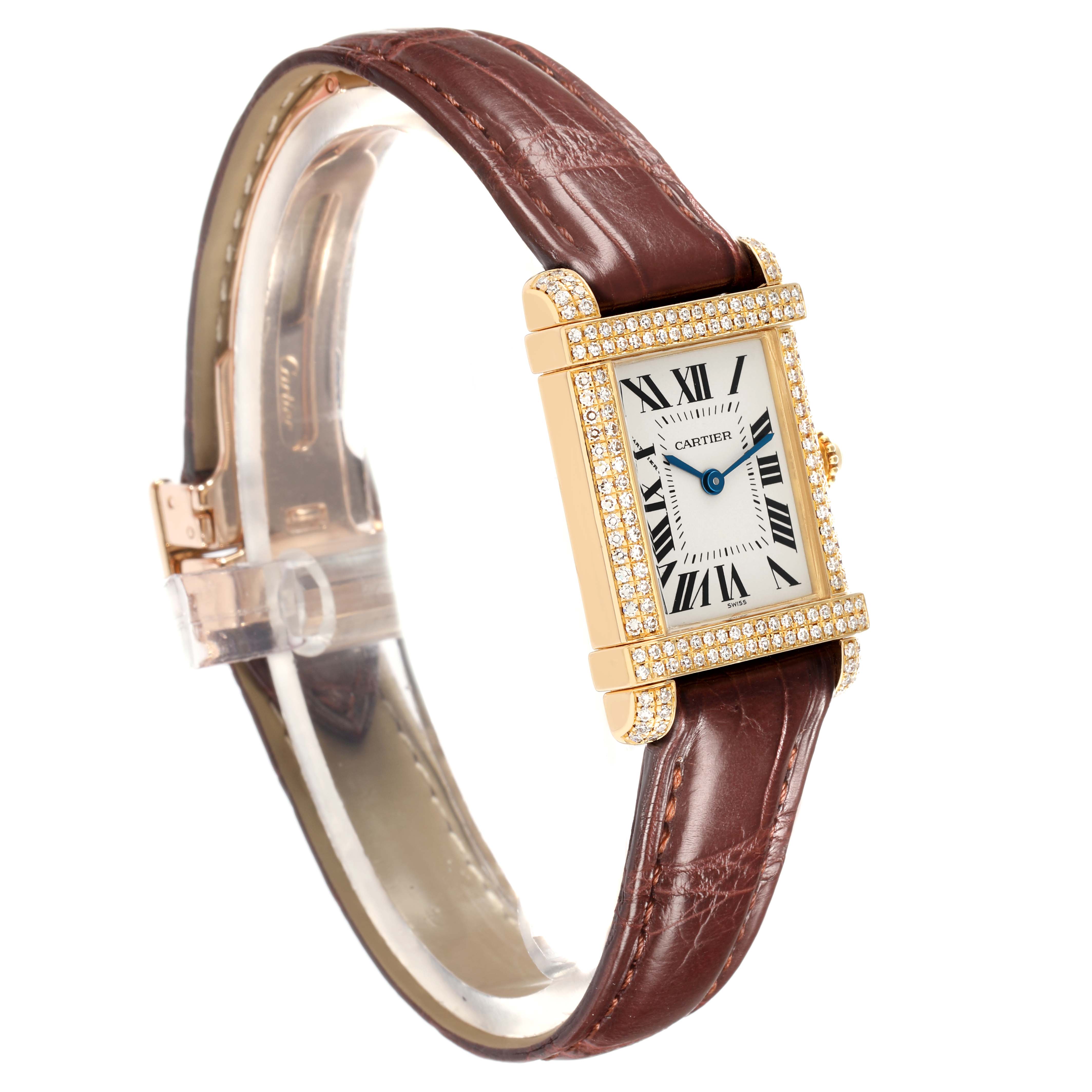 The Cartier Tank Louis 2305 Women
s Yellow Gold Silver Dial watch is shown at a three-quarter angle, highlighting the face, gold bezel with diamonds, and brown leather strap.