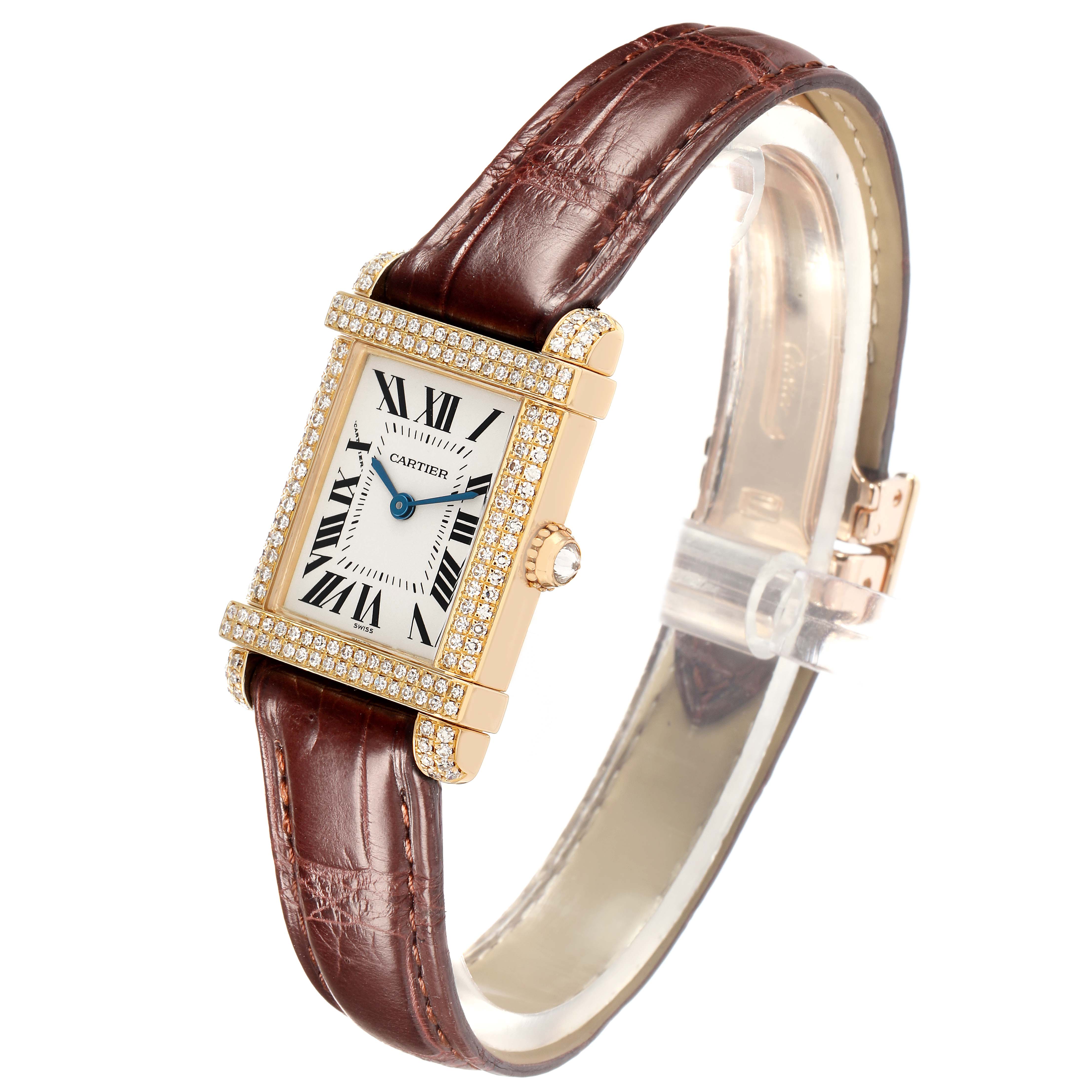 The Cartier Tank Louis 2305 Women
s Yellow Gold Silver Dial watch is shown at an angled view highlighting the diamond-encrusted bezel, brown leather strap, and Roman numeral dial.