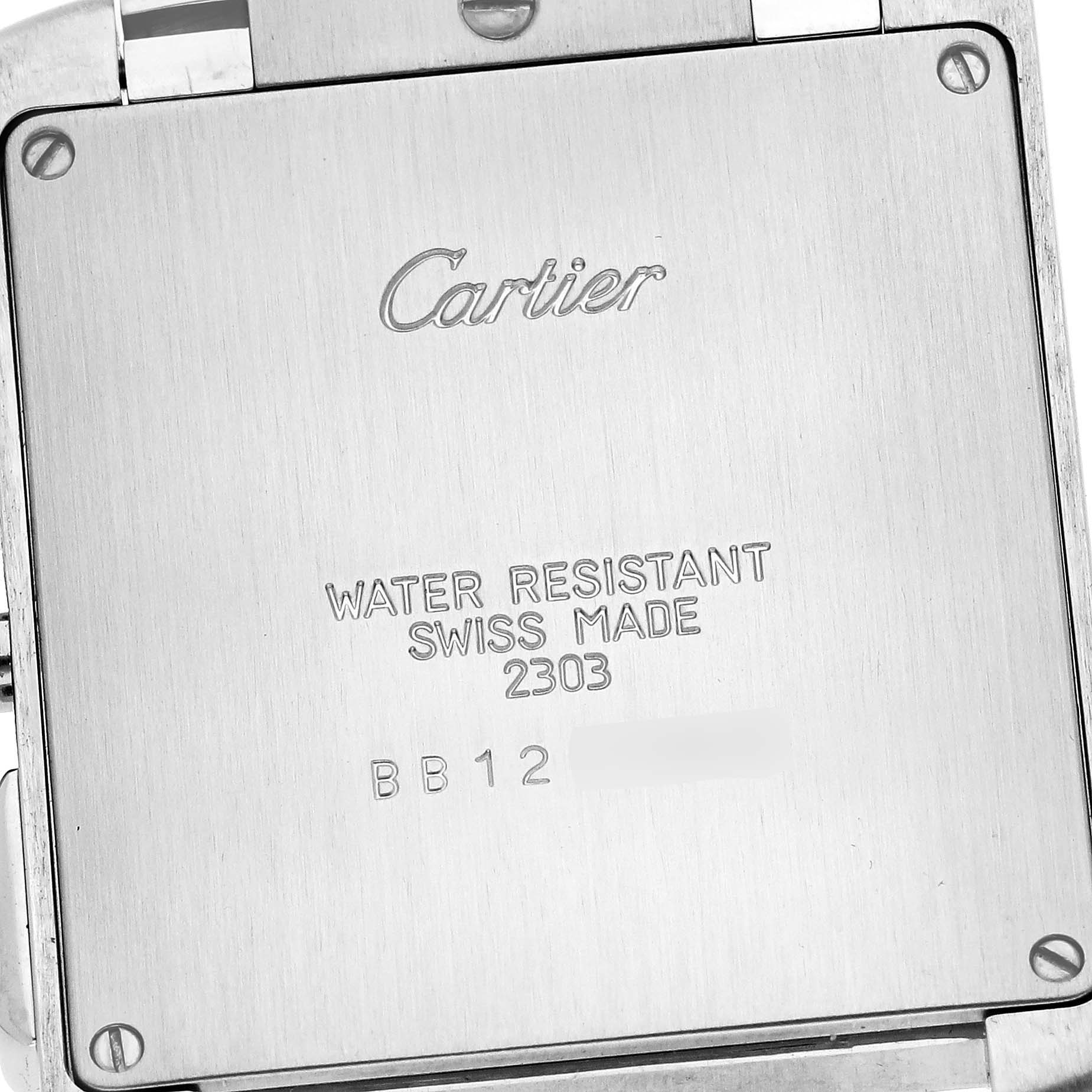 The image shows the back case of a Cartier Tank Francaise W51001Q3 Men
s Stainless Steel Silver Dial W51001Q3 Men
s Stainless Steel Silver Dial watch, displaying its inscriptions and screws.