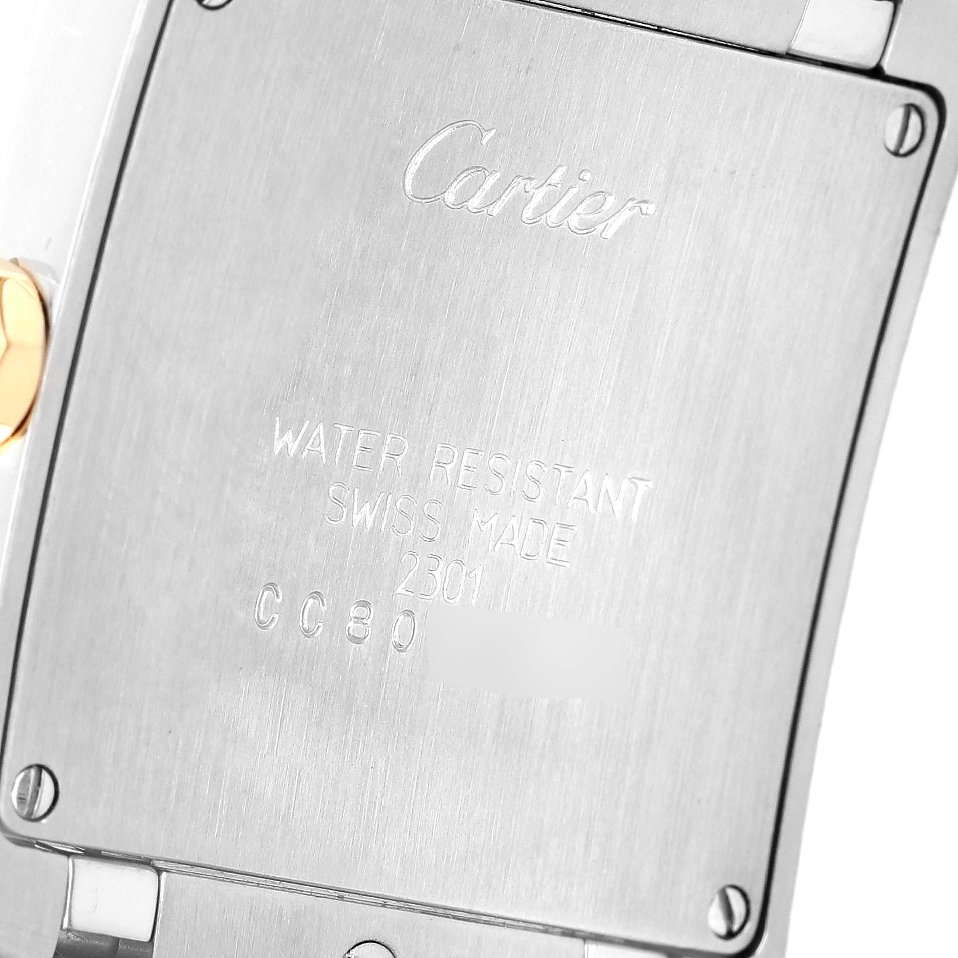 The image shows the back case of a Cartier Tank Francaise W2TA0003 Women's Steel and Gold (two tone) Silver Dial W2TA0003 Women's Steel and Gold (two tone) Silver Dial watch, highlighting the brand's engraving and details.