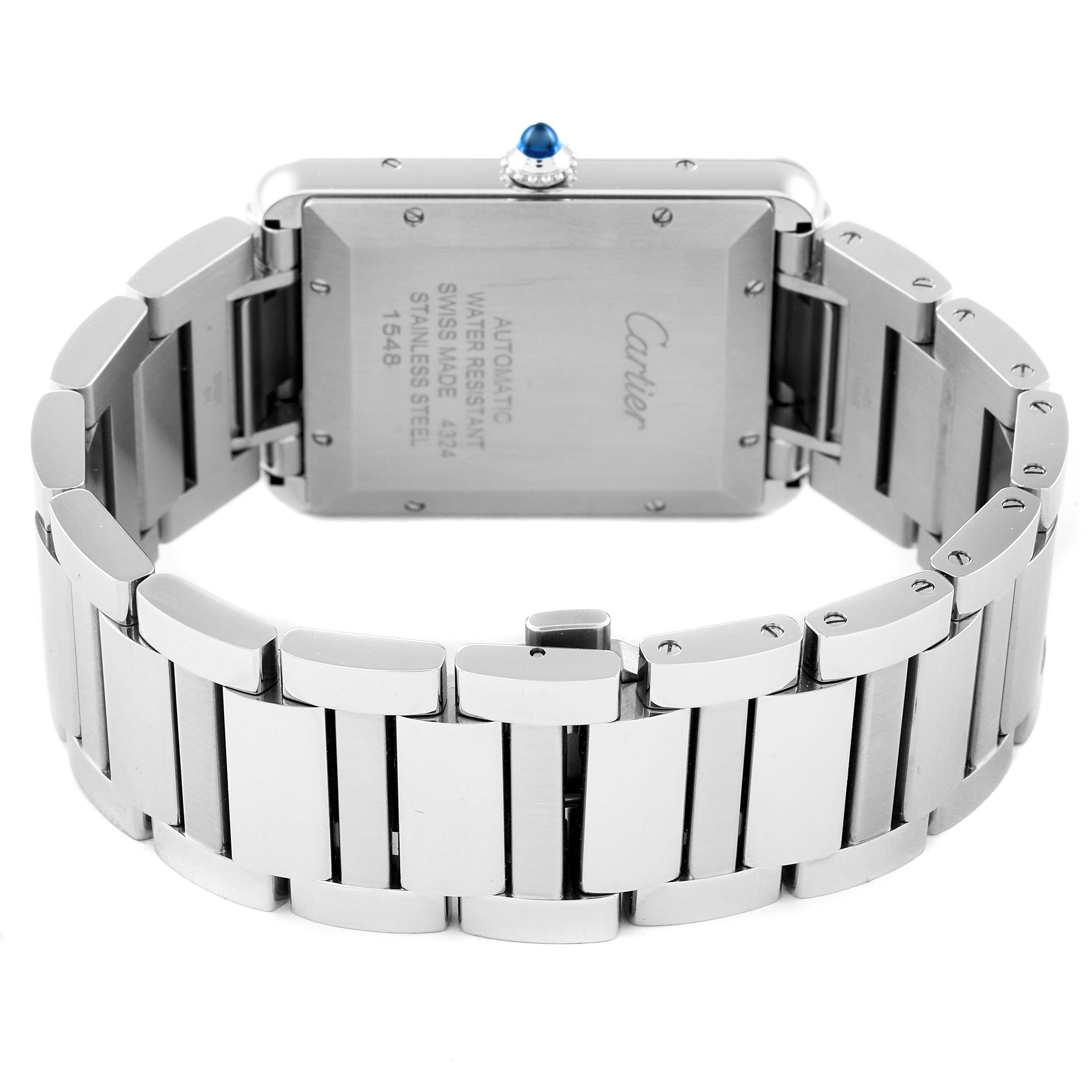 The image shows the back and bracelet of a Cartier Tank Must WSTA0053 Men's Stainless Steel Silver Dial WSTA0053 Men's Stainless Steel Silver Dial watch, highlighting the clasp and case back engravings.