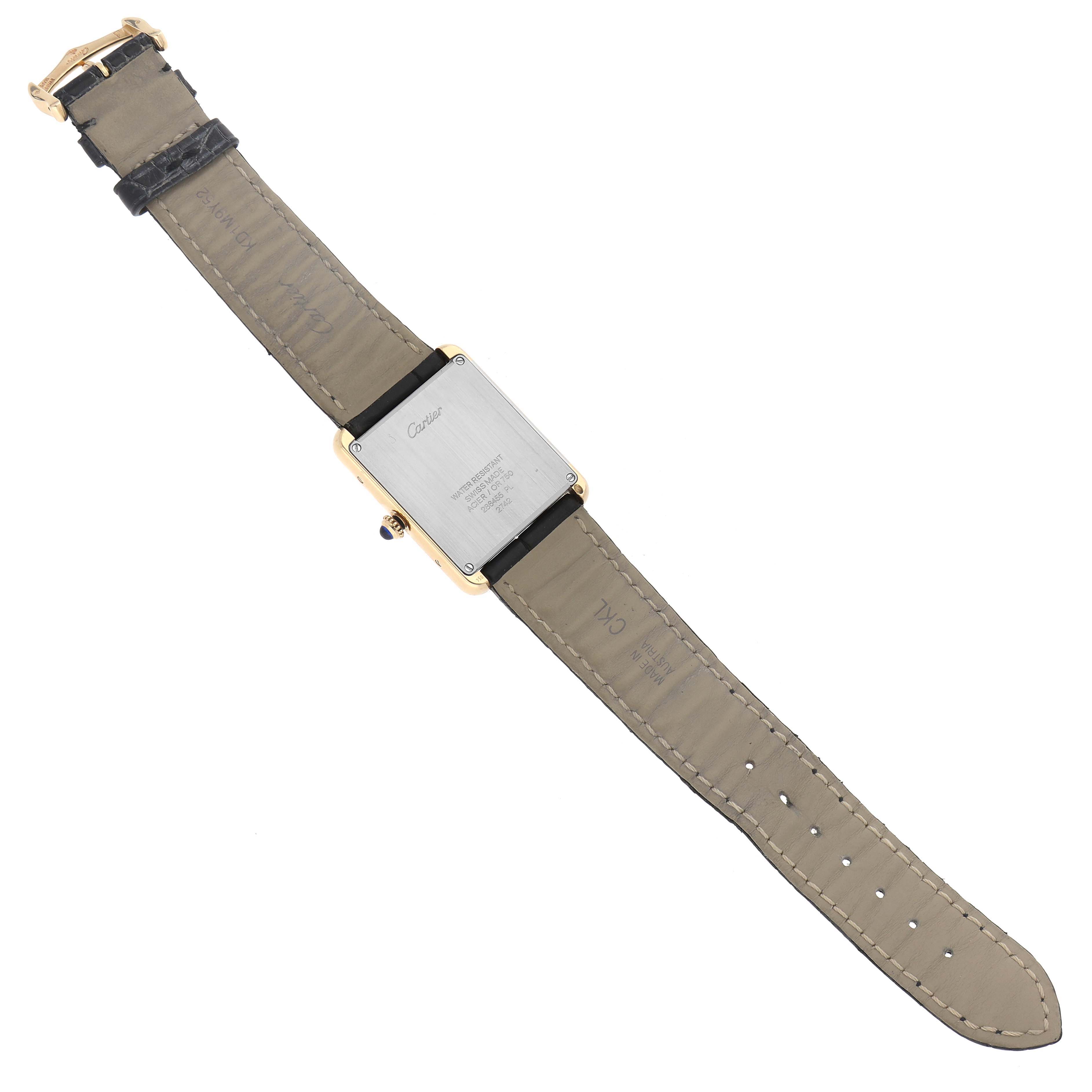 The image shows the back view of a Cartier Tank Solo W1018855 Men's Steel and Gold (two tone) Silver Dial W1018855 Men's Steel and Gold (two tone) Silver Dial watch, displaying its case back and leather strap.