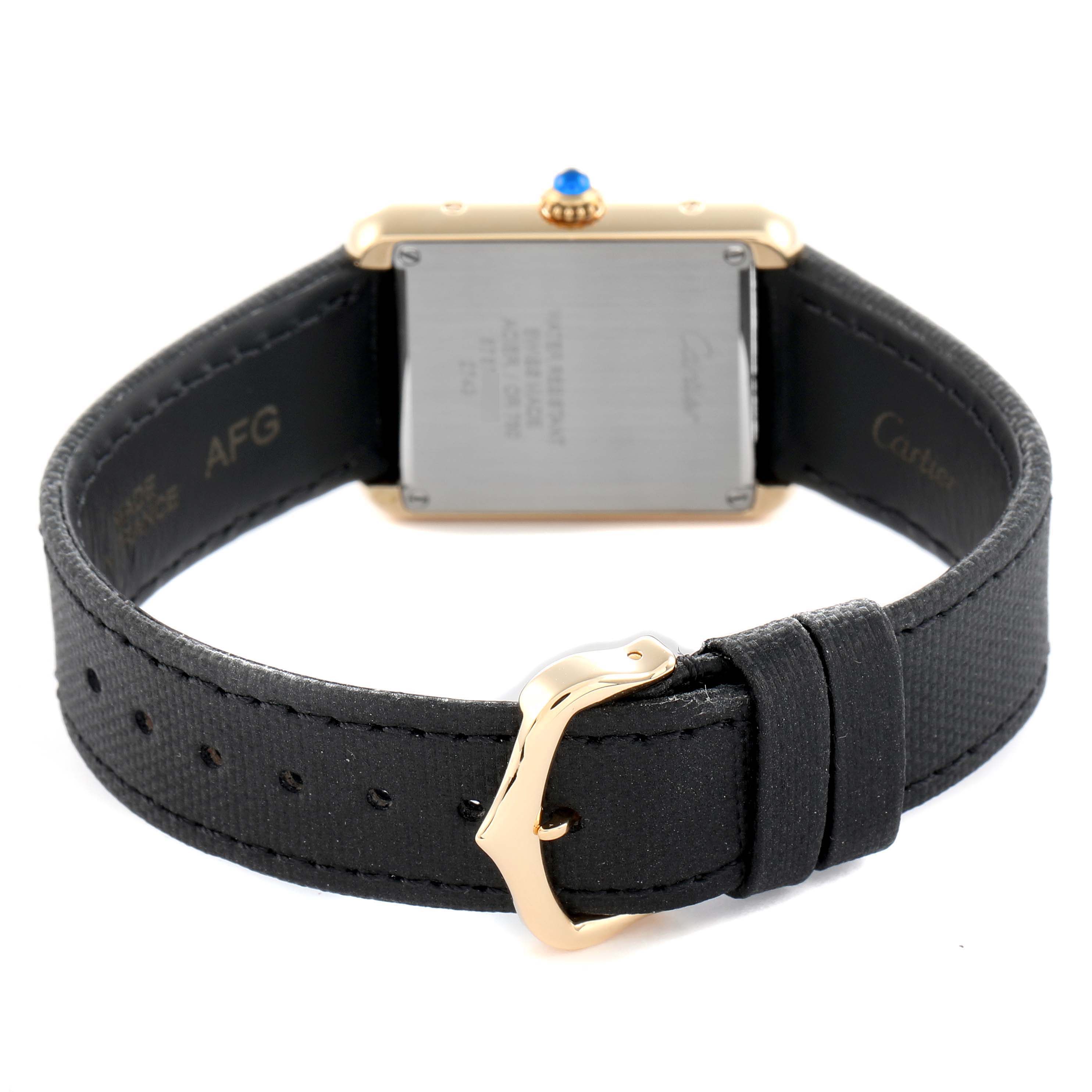 The Cartier Tank Solo W5200002 Women
s Steel and Gold (two tone) Silver Dial watch is shown from the back, highlighting the case back, strap, and buckle.