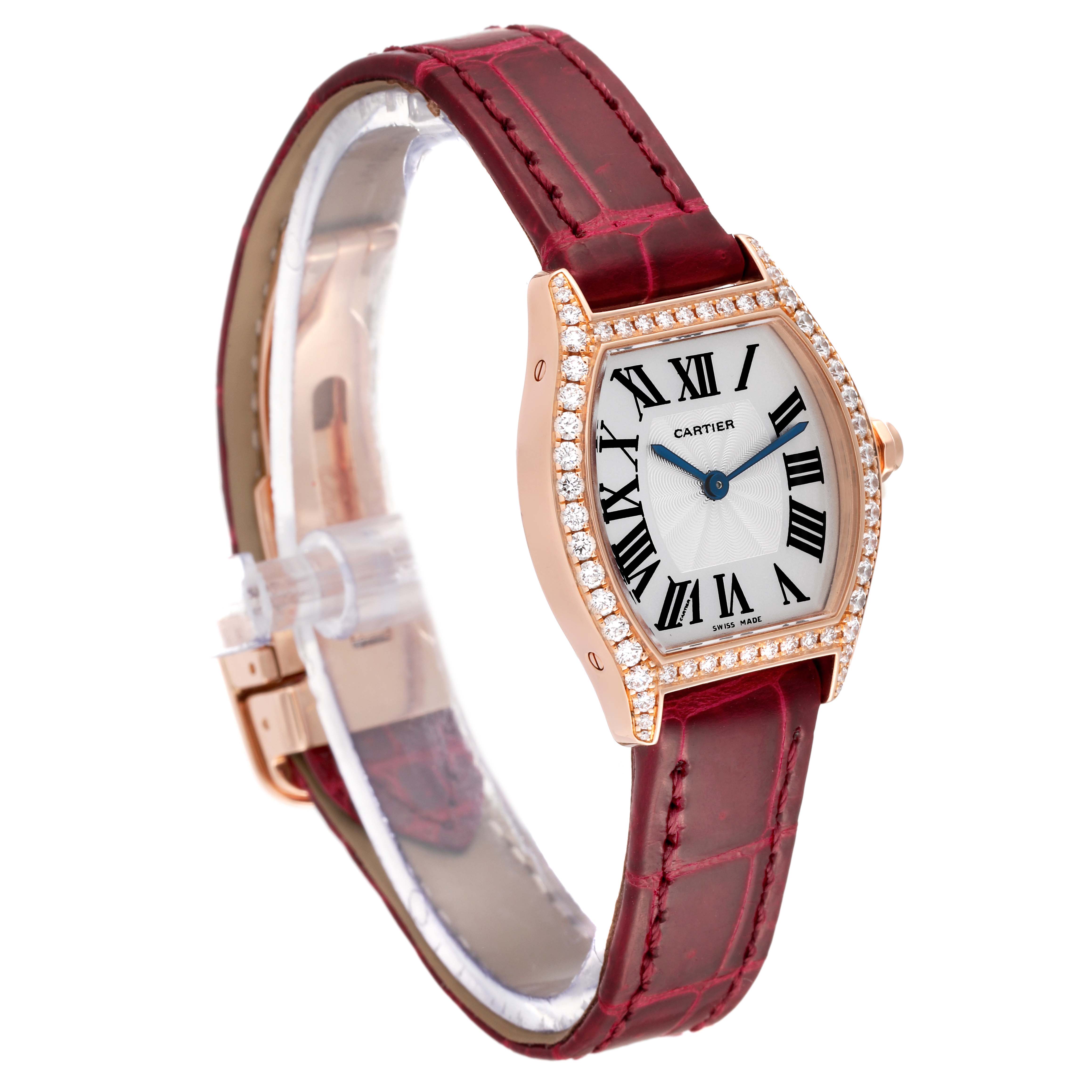 This image shows a Cartier Tortue WA501006 Women
s Rose Gold Silver Dial WA501006 Women
s Rose Gold Silver Dial watch with a diamond-studded bezel and a red leather strap, viewed from an angled perspective.