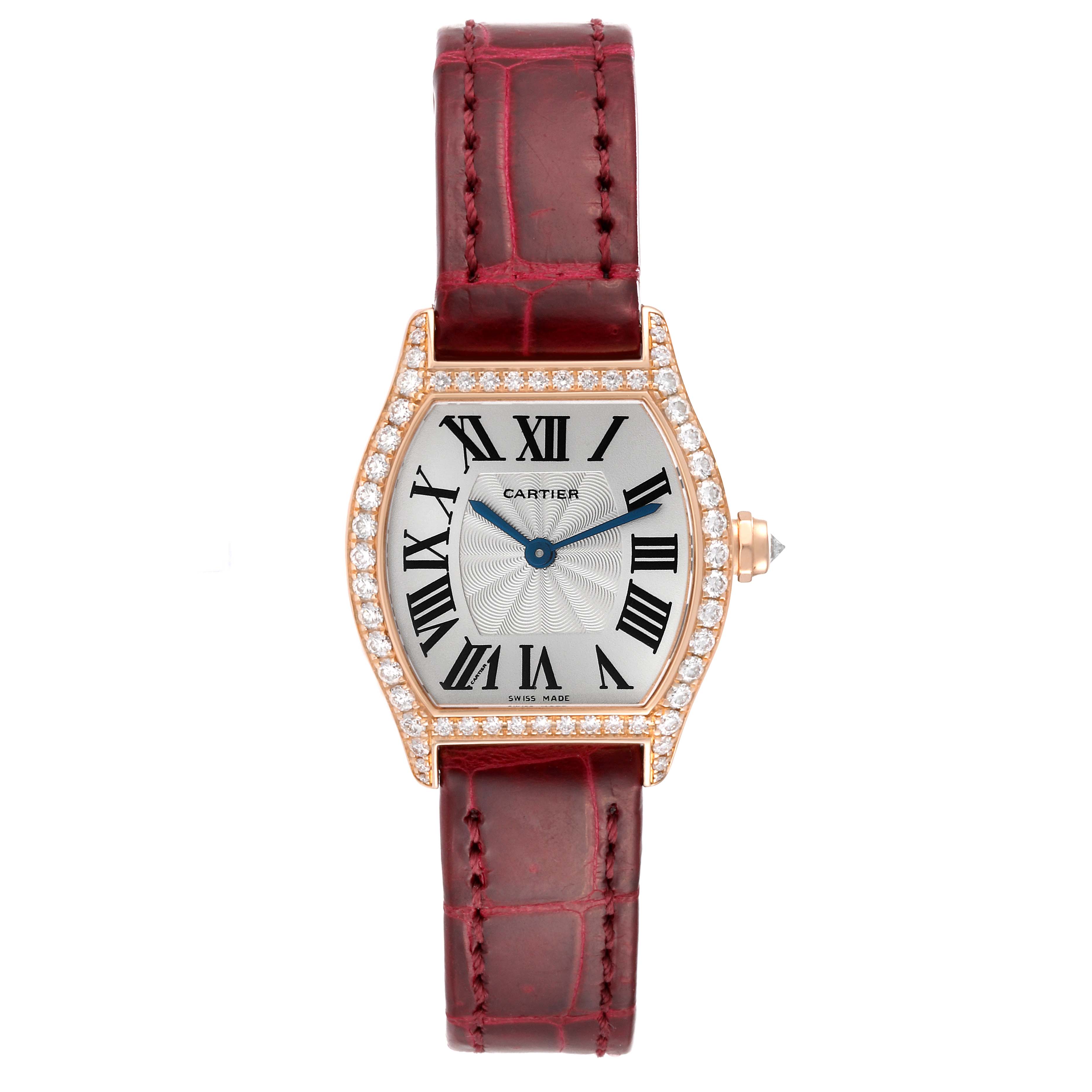 This Cartier Tortue WA501006 Women
s Rose Gold Silver Dial WA501006 Women
s Rose Gold Silver Dial watch is shown from the front, displaying the face with Roman numerals, a diamond bezel, and a red leather strap.