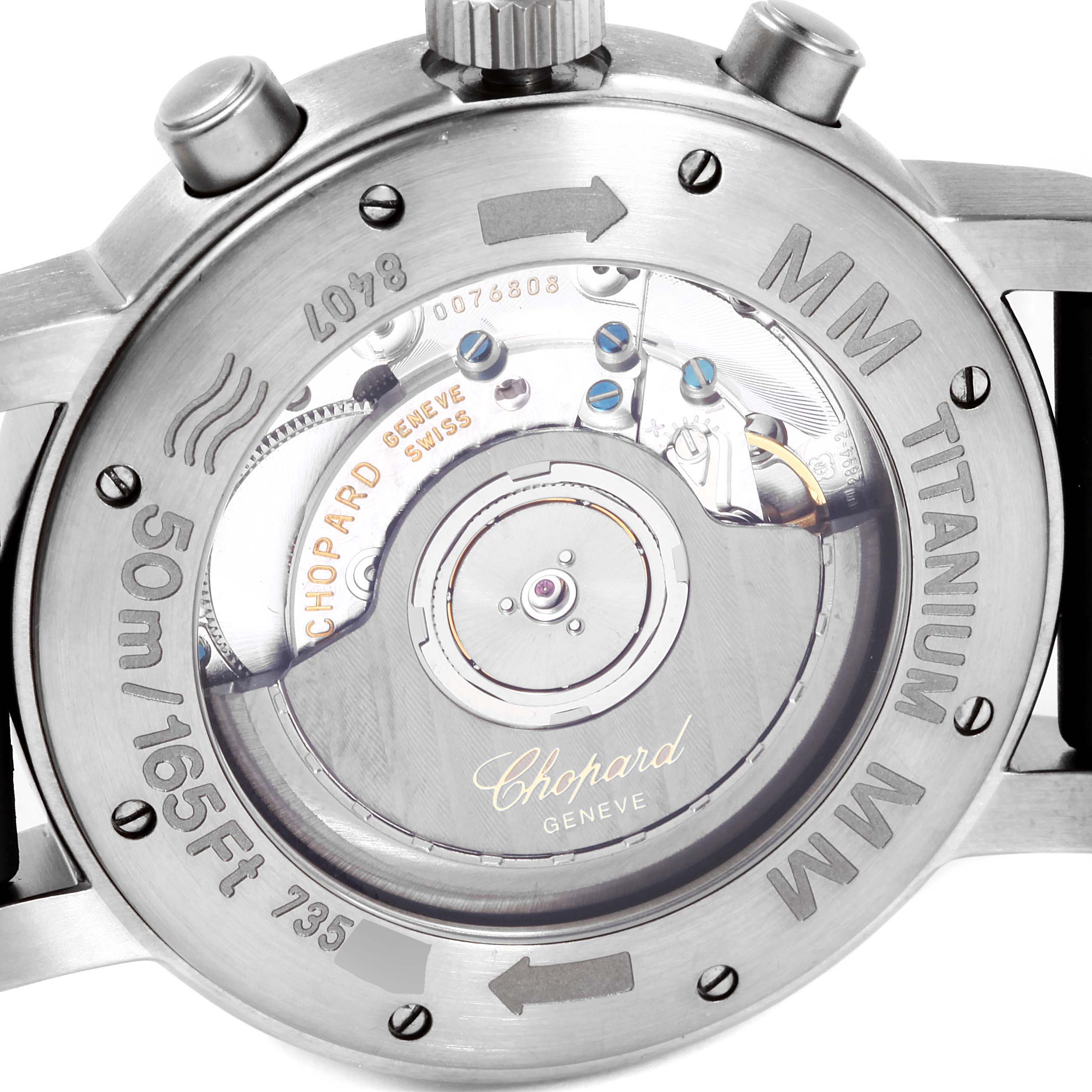 The image shows the back view of the Mille Miglia model by Chopard, revealing the automatic movement and inscriptions on the case.