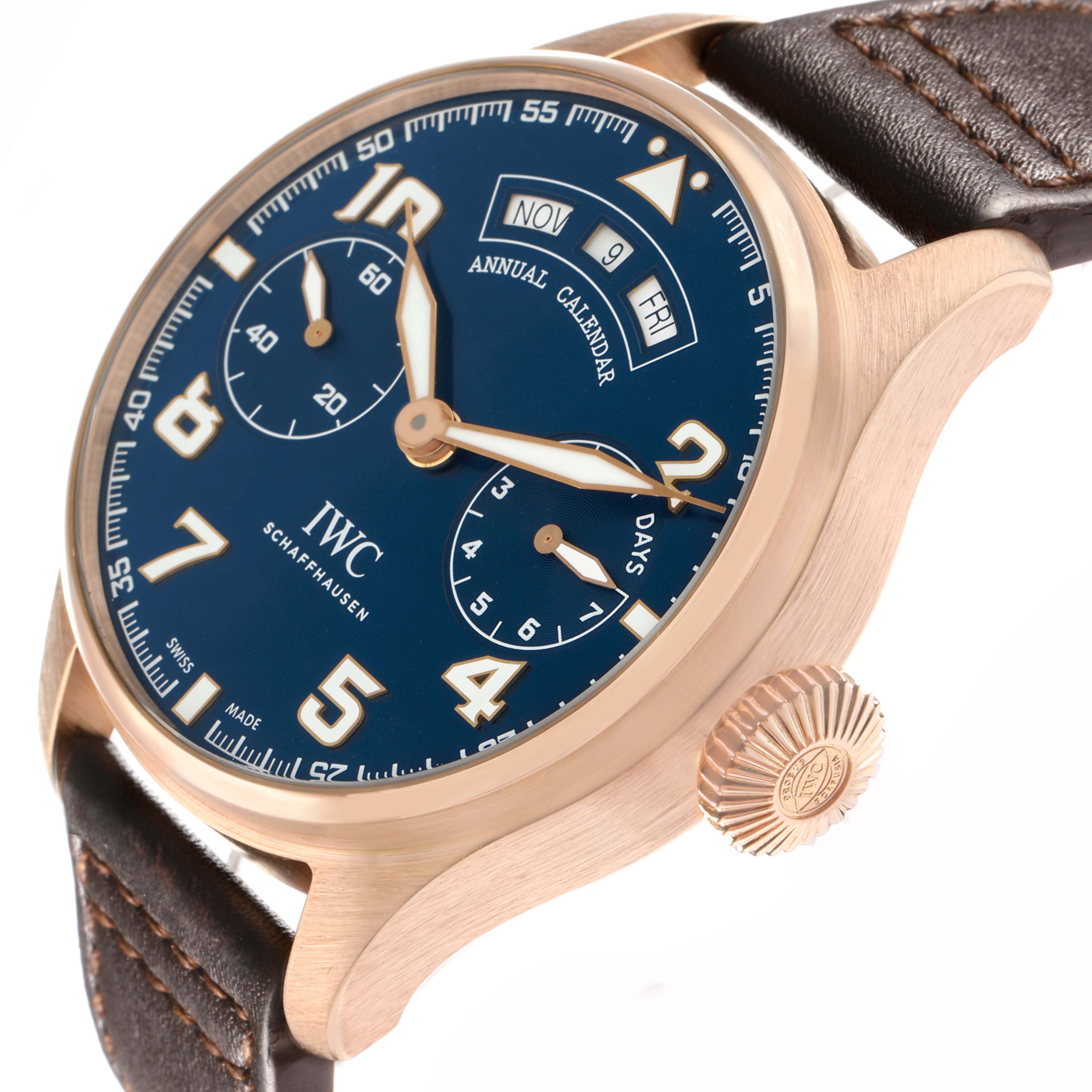 The IWC Pilot IW502701 Men
s Rose Gold Blue Dial watch is shown from a slightly angled side view, displaying the face, crown, and leather strap.