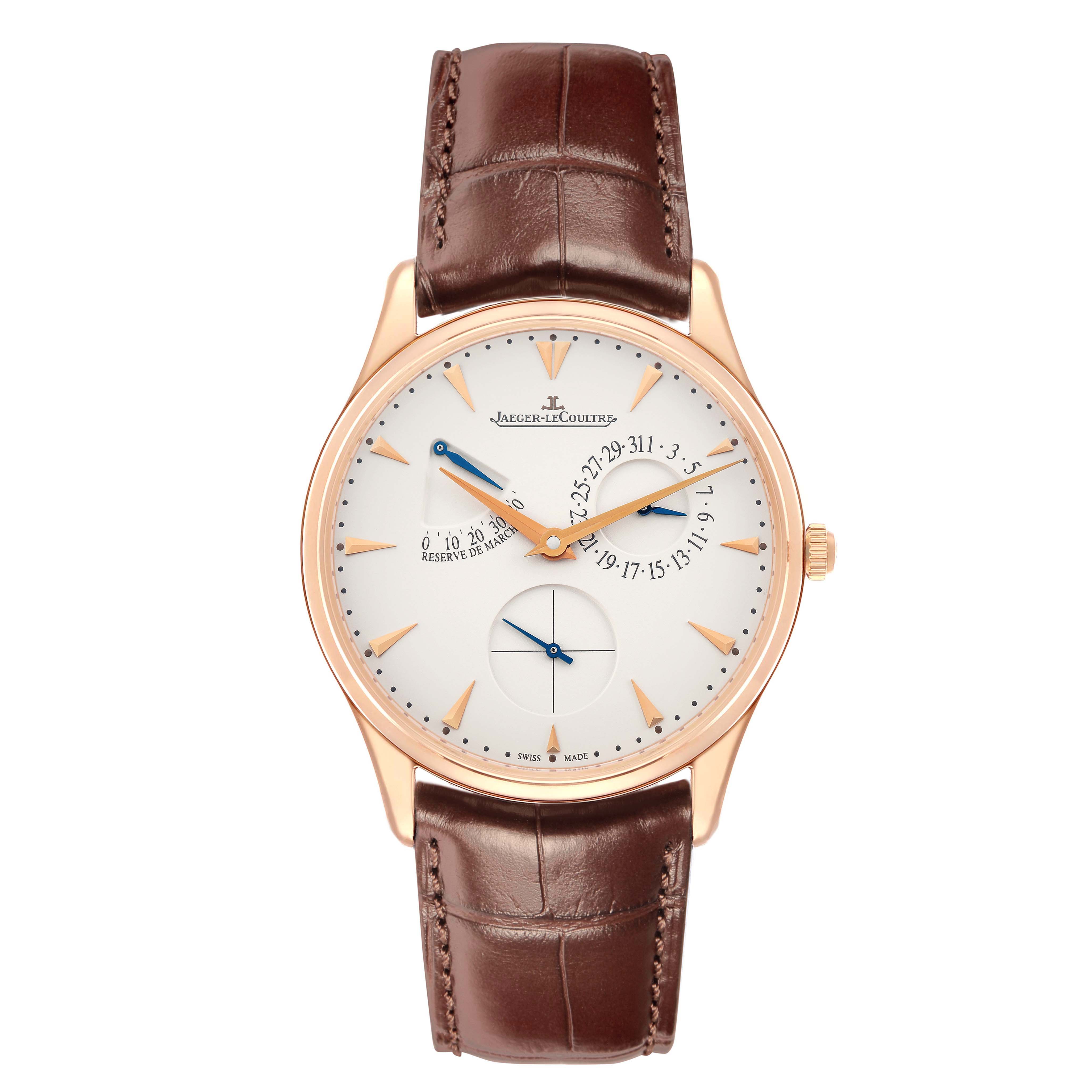 The Jaeger-LeCoultre Master watch is shown from a top-down angle, displaying the dial, hands, and brown leather strap.