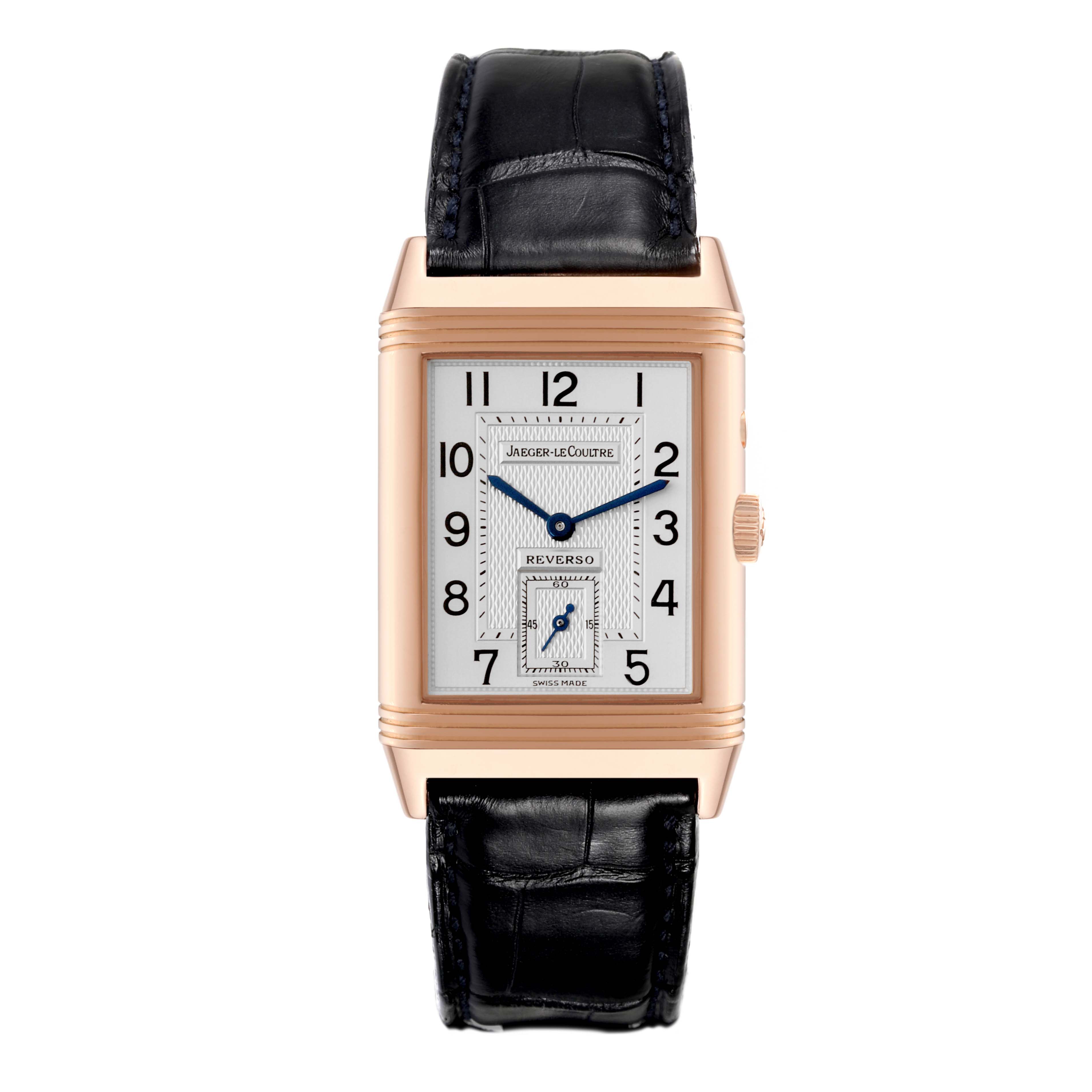 The image shows a front view of a Jaeger LeCoultre Reverso Q2712470 Men's Rose Gold Silver Dial Q2712470 Men's Rose Gold Silver Dial watch, highlighting its rectangular dial, gold case, and black leather strap.